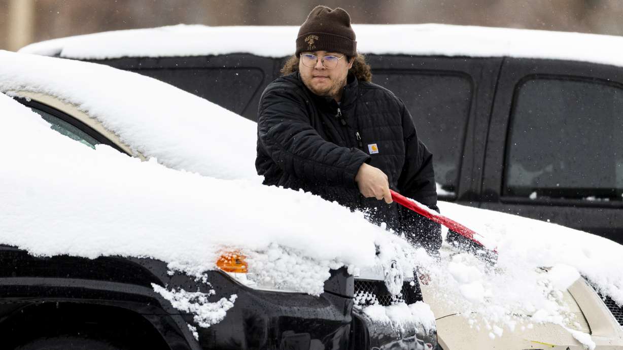 Jorma Thornbrugh brushes snow from a vehicle in Salt Lake City Wednesday. A new long-range outlook for the upcoming meteorological spring, released Thursday, isn't ideal for Utah's water conditions but might not be the worst-case scenario.