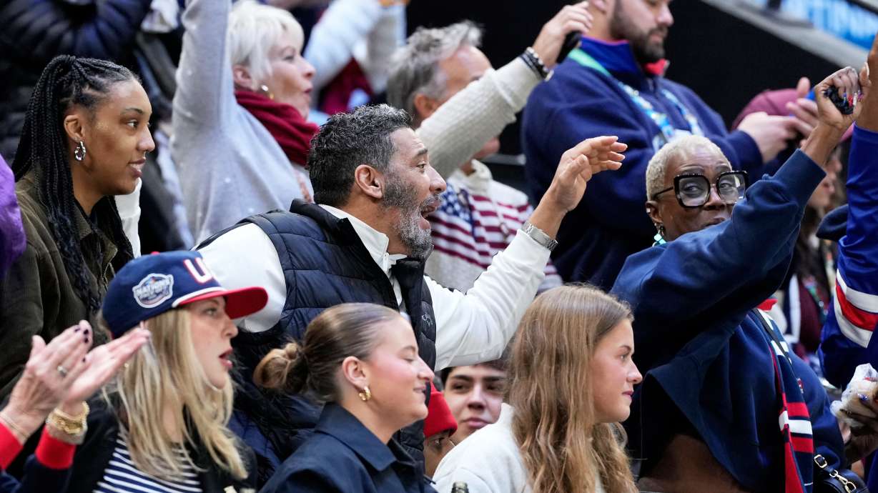 Family members of United States' Laila Edwards cheer during a women's ice hockey semifinal game between the United States and Sweden at the 2026 Winter Olympics, in Milan, Italy, Monday, Feb. 16, 2026.