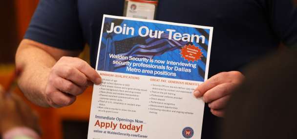 US applications for jobless aid fall to 206,000 last week as layoffs remain low