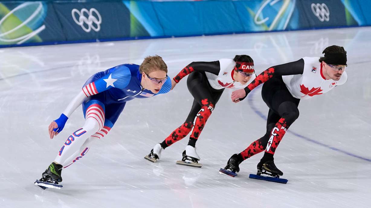 Speed skaters Jordan Stolz of the U.S., left, Beatrice Lamarche of Canada, center, and Cedrick Brunet of Canada practices at the 2026 Winter Olympics, in Milan, Italy, Tuesday, Feb. 17, 2026.