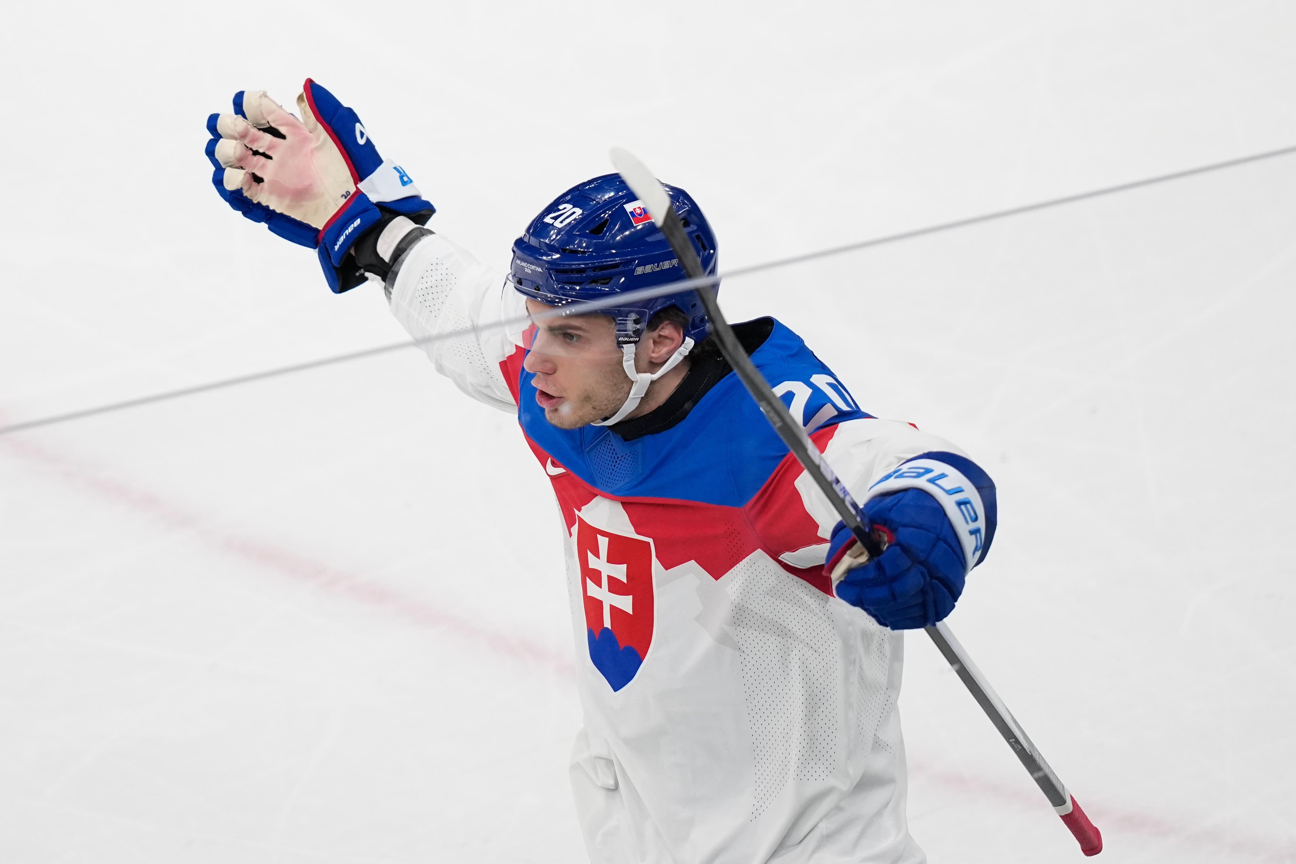 Slovakia's Juraj Slafkovsky celebrates after scoring his side's opening goal during a preliminary round match of men's ice hockey between Sweden and Slovakia at the 2026 Winter Olympics, in Milan, Italy, Saturday, Feb. 14, 2026. 