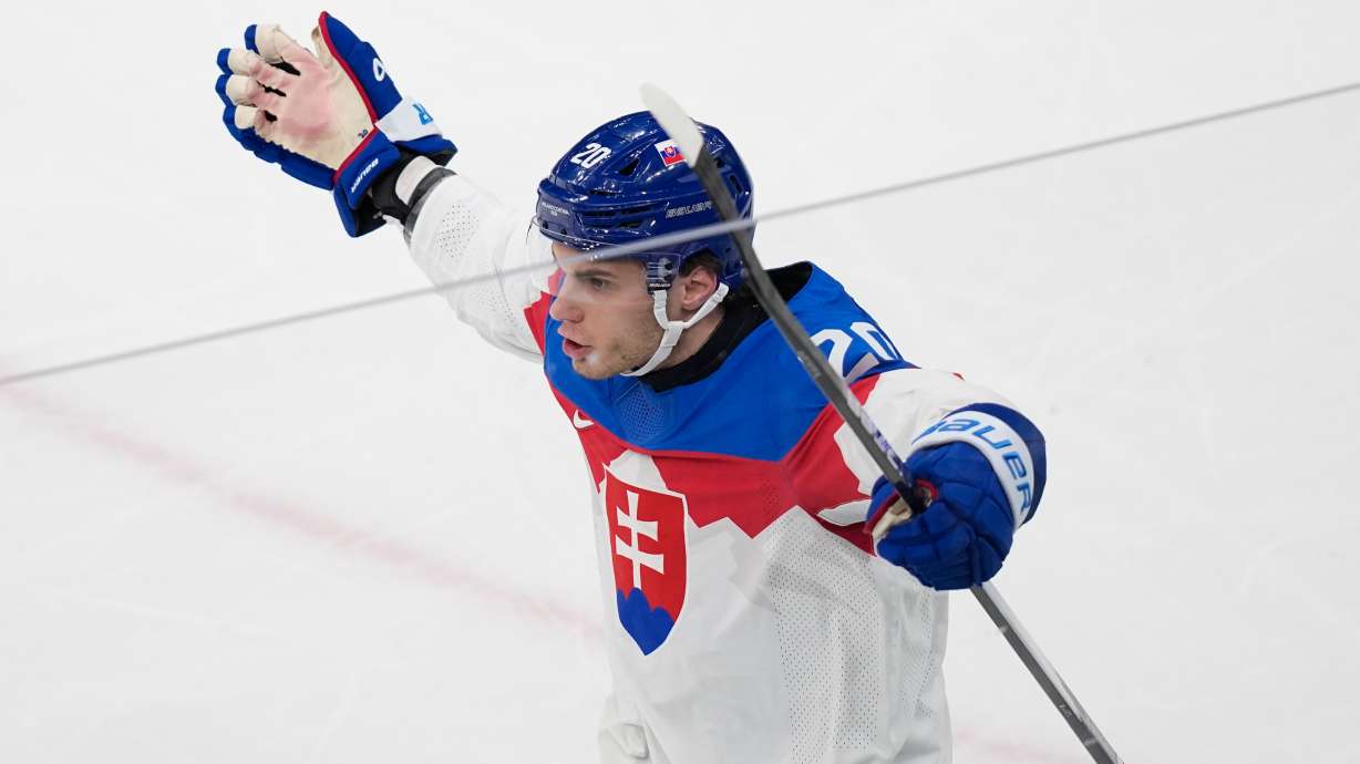Slovakia's Juraj Slafkovsky celebrates after scoring his side's opening goal during a preliminary round match of men's ice hockey between Sweden and Slovakia at the 2026 Winter Olympics, in Milan, Italy, Saturday, Feb. 14, 2026.