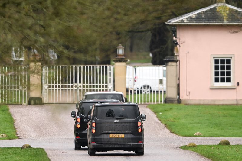 Vans drive to enter the Royal Lodge, a property on the estate surrounding Windsor Castle and a former residence of Andrew Mountbatten Windsor, younger brother of Britain’s King Charles, formerly known as Prince Andrew, who was arrested this morning on suspicion of misconduct in public office, after the U.S. Justice Department released more records tied to the late financier and convicted sex offender Jeffrey Epstein, in Windsor, Britain, Thursday.