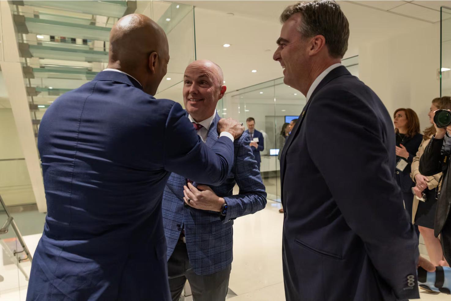 Maryland Gov. Wes Moore, left, talks with Utah Gov. Spencer Cox, center, and Oklahoma Gov. Kevin Stitt at a Disagree Better event hosted by the Pew Charitable Trusts on Wednesday, in Washington, D.C., ahead of the National Governors Association meetings this week.