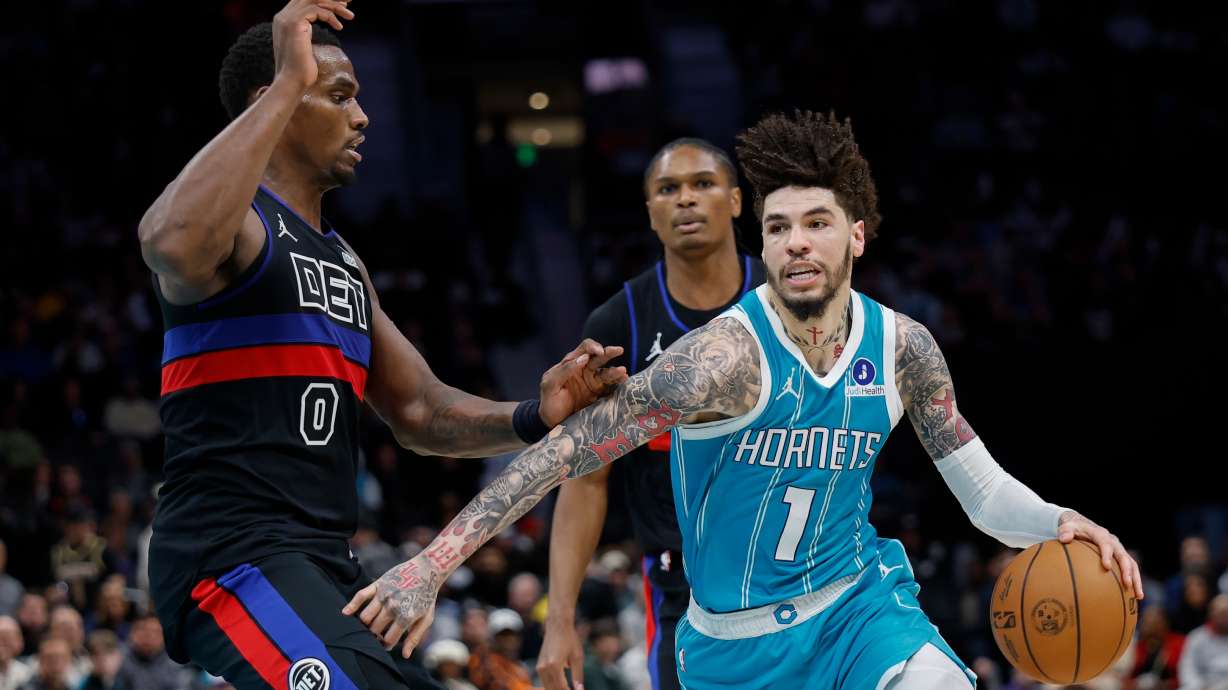 Charlotte Hornets guard LaMelo Ball (1) drives against Detroit Pistons center Jalen Duren (0) during the second half of an NBA basketball game in Charlotte, N.C., Monday, Feb. 9, 2026.