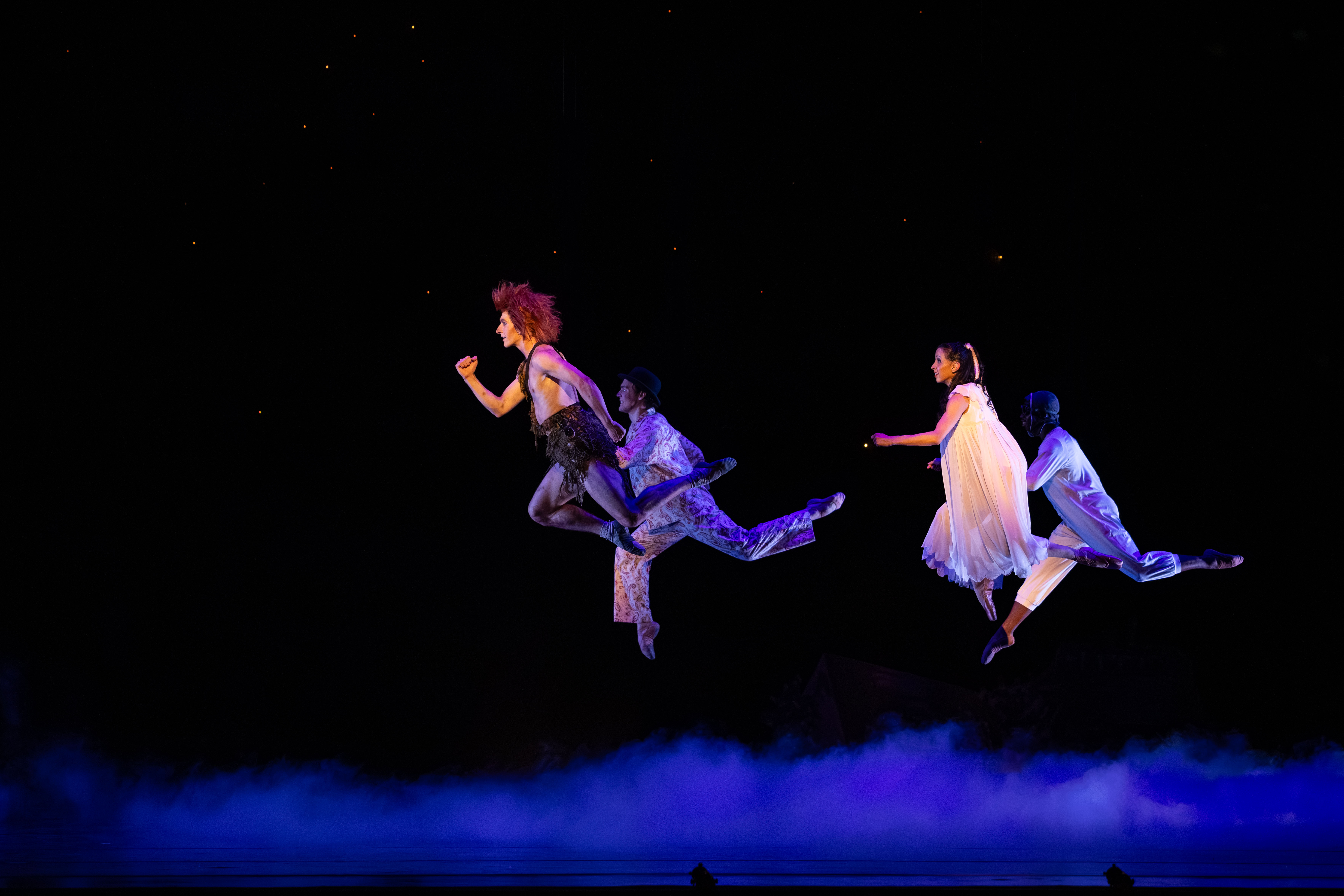 Ballet West dancers fly above the stage during "Peter Pan" in February 2026 in Salt Lake City.