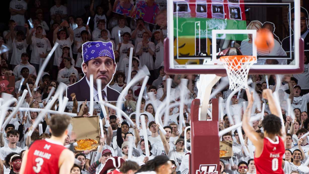 The Massachusetts student section cheers as Miami Ohio wing Eian Elmer (0) attempts a free throw during the NCAA basketball game at The Mullins Center in Amherst, Mass., Tuesday, Feb. 17, 2026.