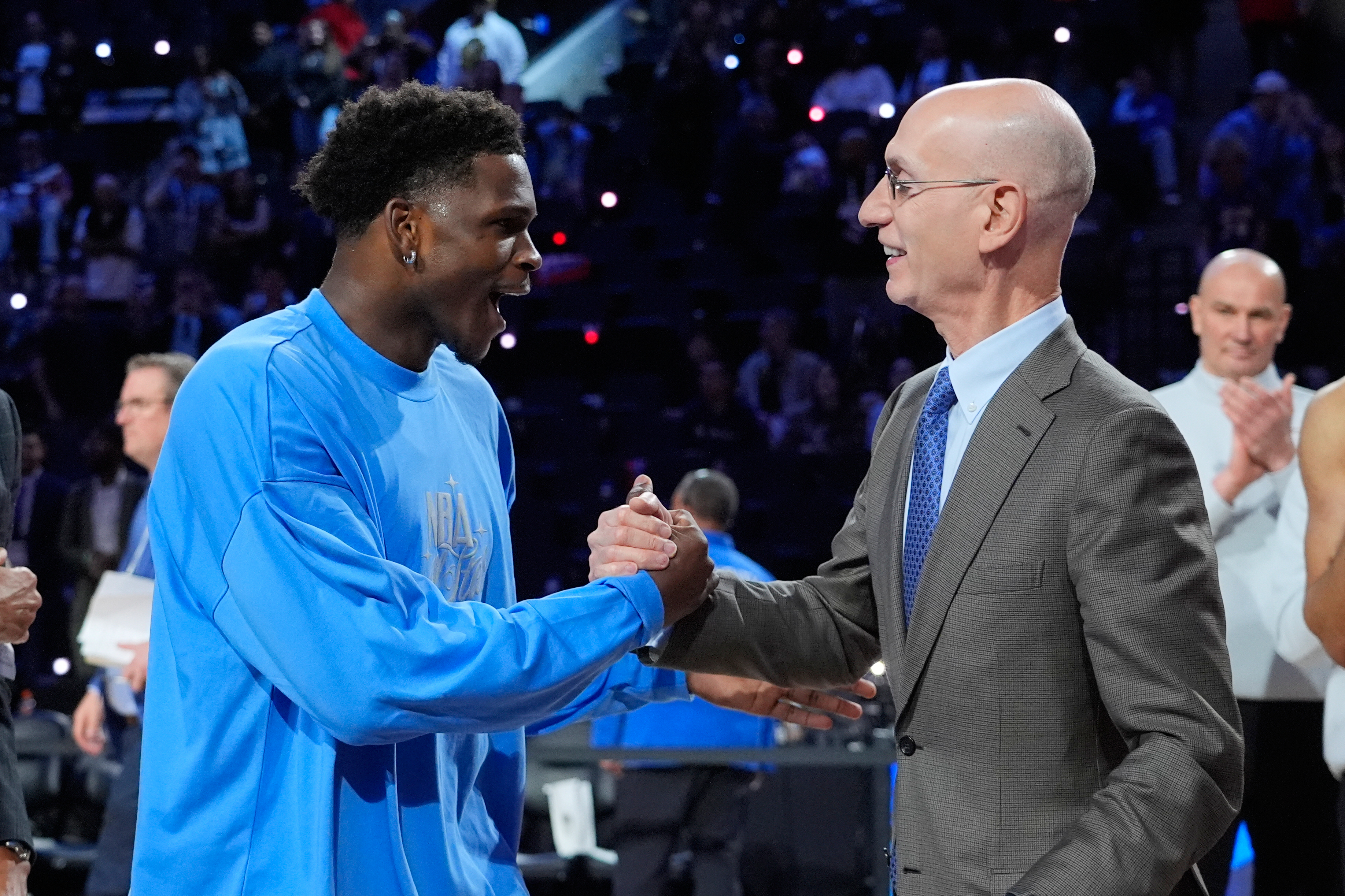 USA Stars guard Anthony Edwards, left, shakes hands with commissioner Adam Silver after the NBA All-Star basketball game Sunday, Feb. 15, 2026, in Inglewood, Calif.