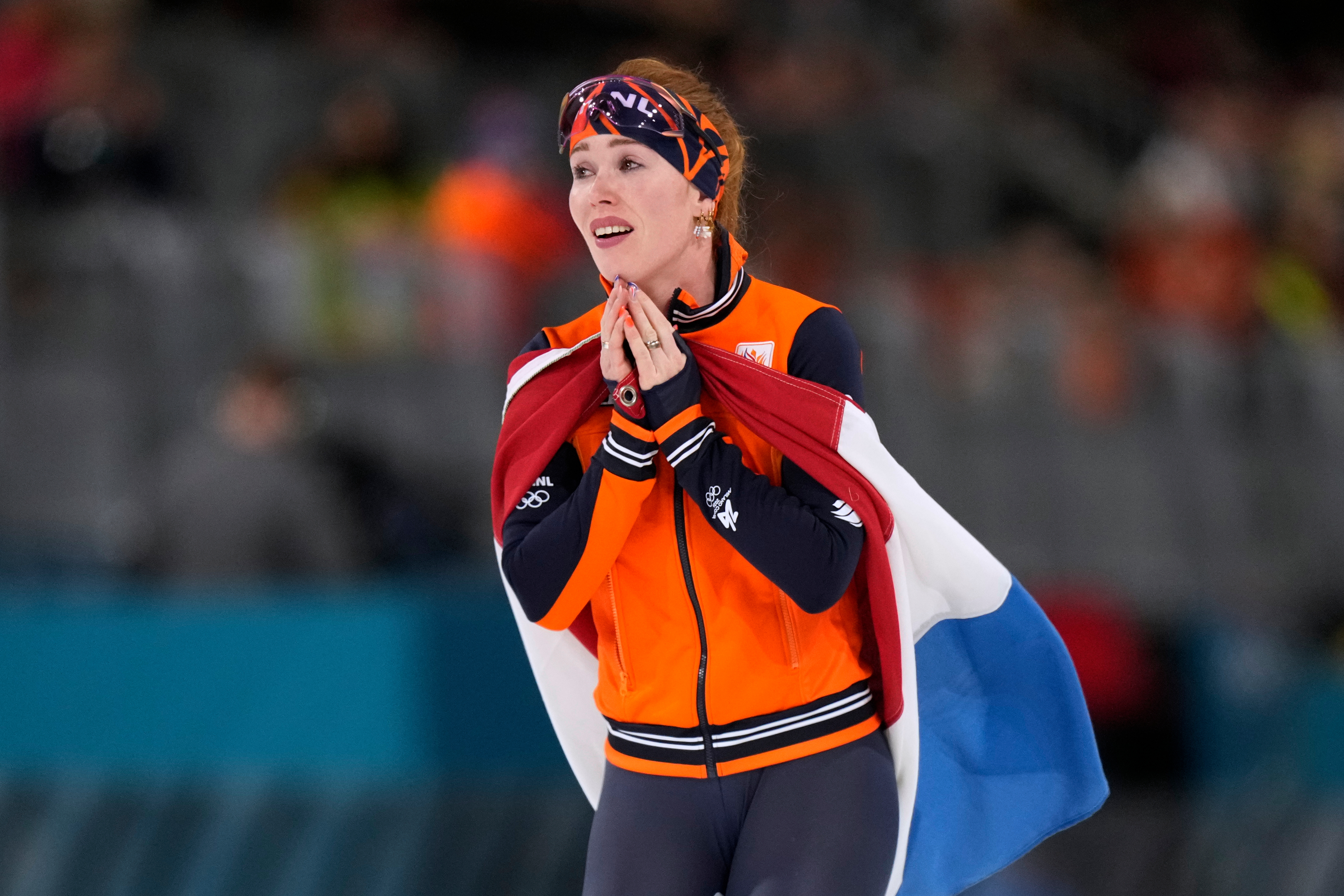Antoinette Rijpma-de Jong of the Netherlands celebrates winning the gold medal in the women's 1500 meters speedskating race at the 2026 Winter Olympics, in Milan, Italy, Friday, Feb. 20, 2026.