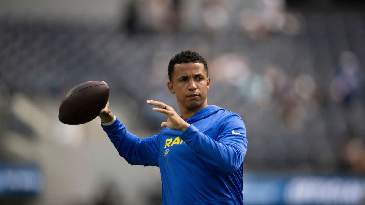 FILE - Los Angeles Rams pass game coordinator Nate Scheelhaase throws the ball before an NFL preseason football game against the Dallas Cowboys, Saturday, Aug. 9, 2025, in Inglewood, Calif.