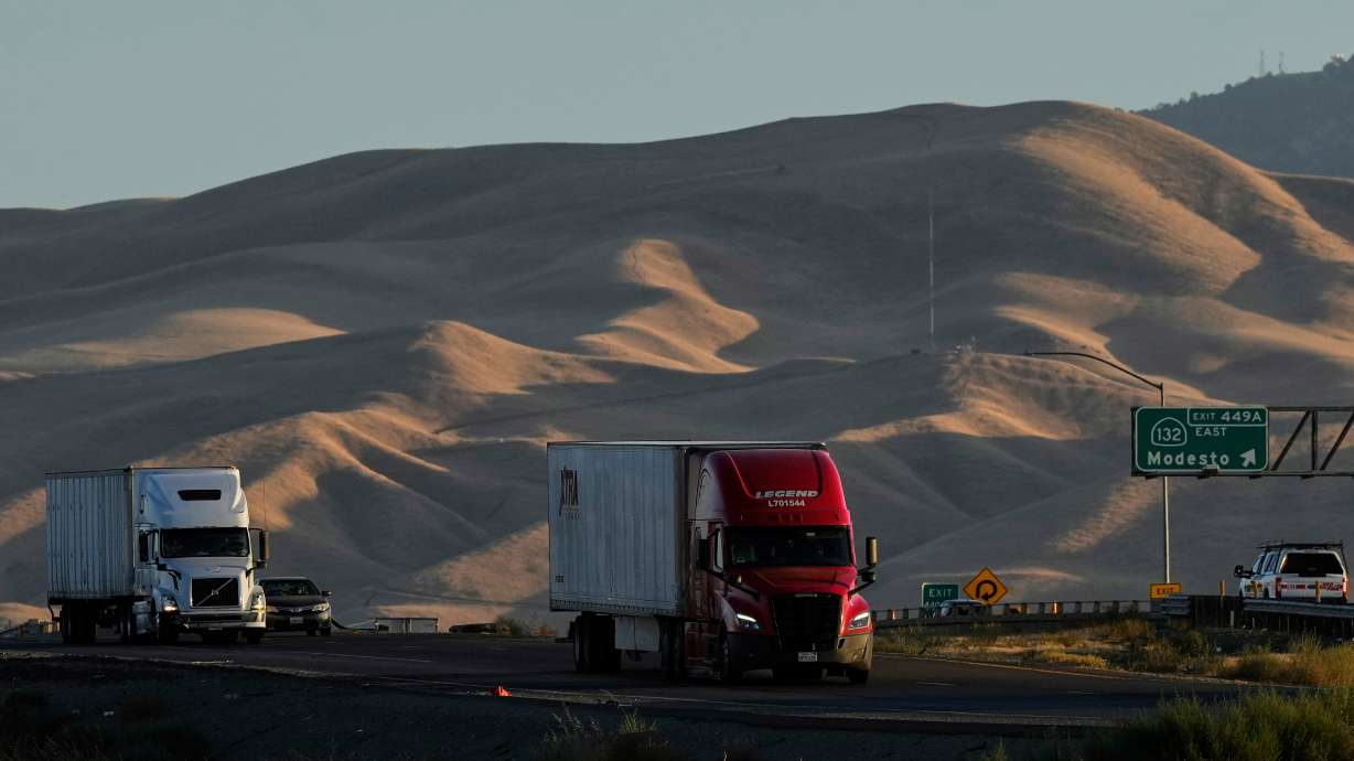 Freight trucks travel northbound on Interstate 5, Sept. 3, 2025, in Tracy, Calif. All truckers and pass drivers will have to take their commercial driver's license tests in English as the Trump administration expands its campaign to improve industry safety.