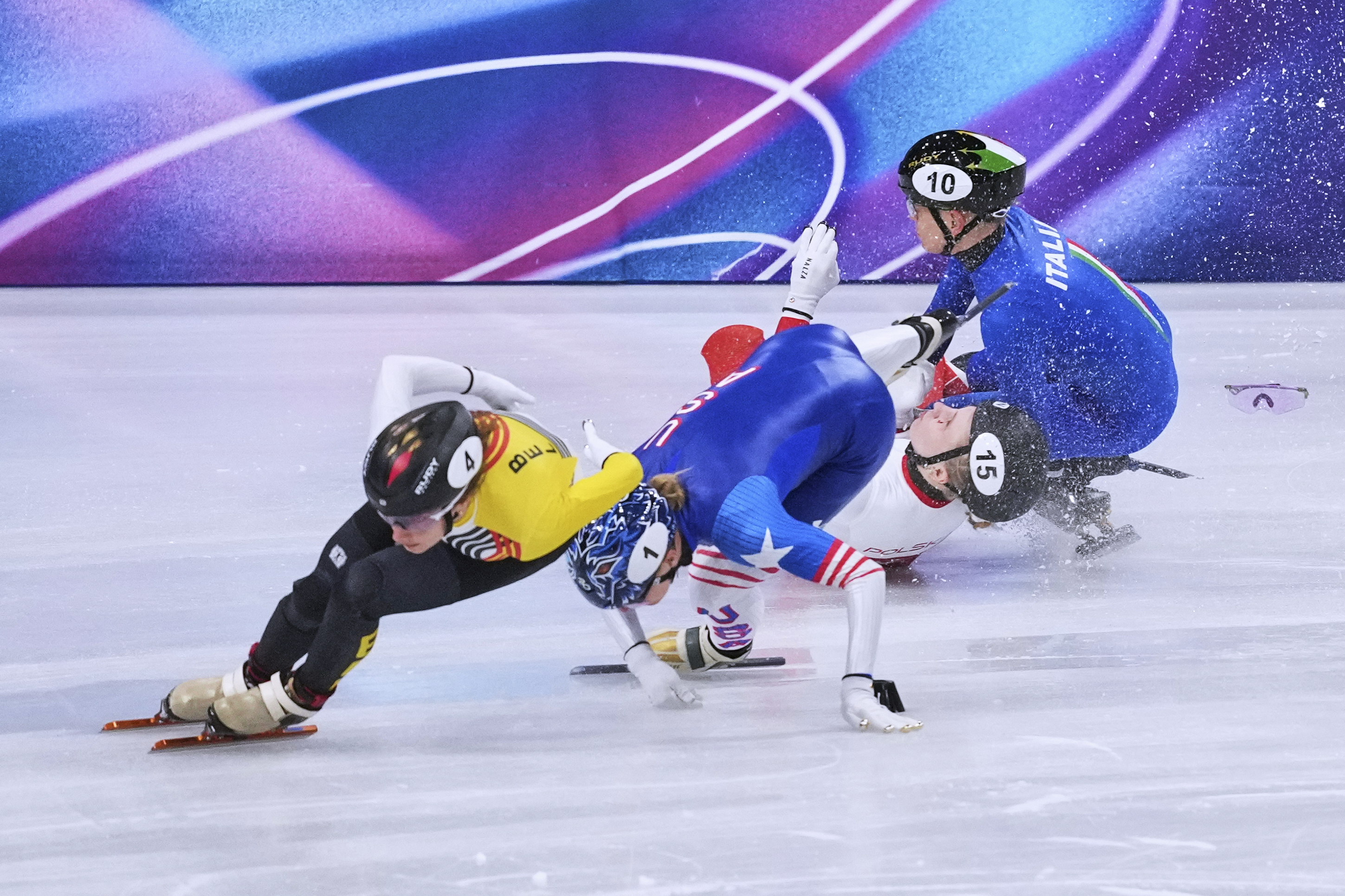Kamila Sellier of Poland falls during the women's 1,500 meters short track speedskating quarterfinal at the 2026 Winter Olympics, in Milan, Italy, Friday, Feb. 20, 2026.