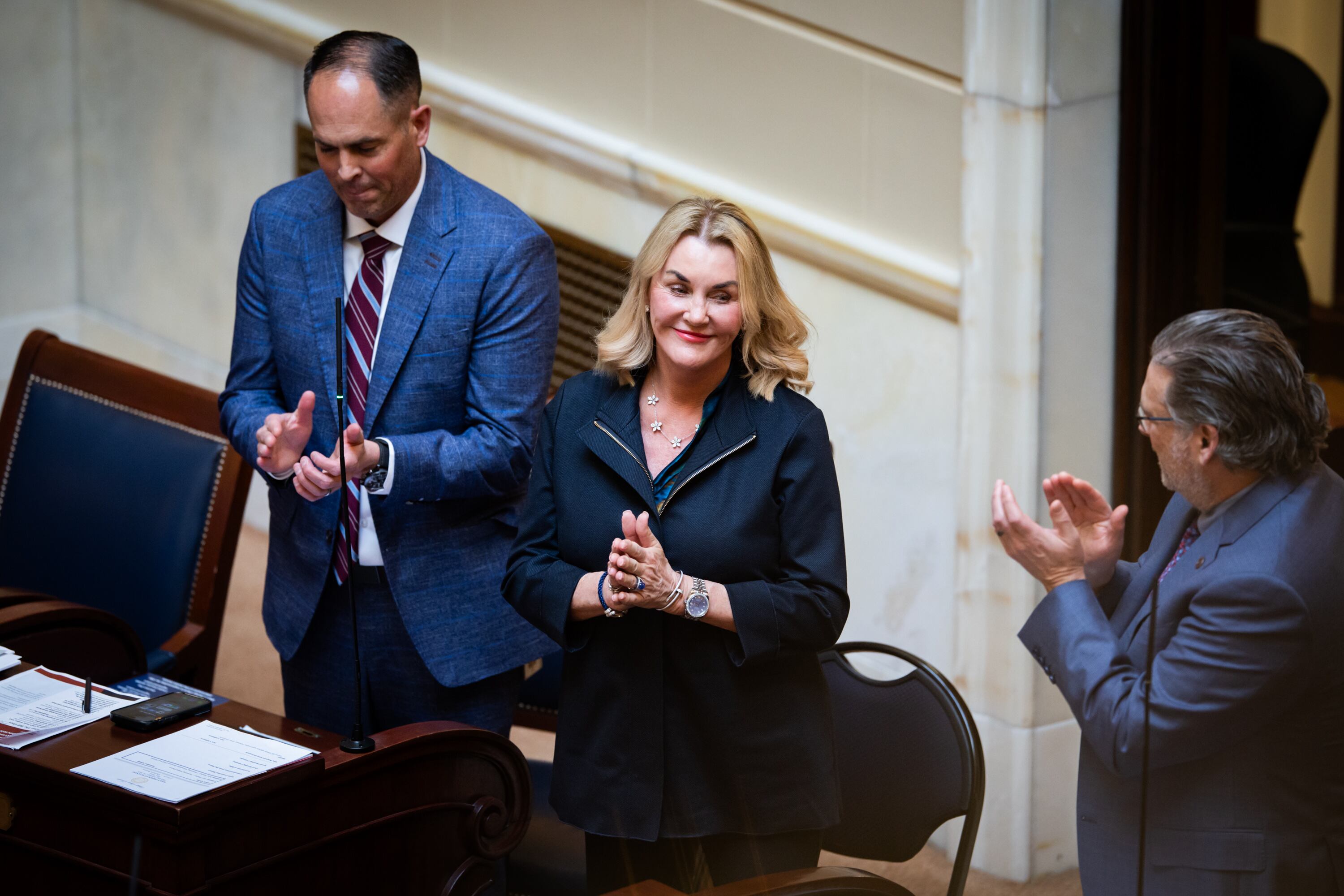 Patti Wheeler, from Florida, whose son died from a kratom overdose, center, is recognized as she stands with Sen. Mike McKell, R-Spanish Fork, left, on the Senate floor at the Capitol in Salt Lake City on Thursday.