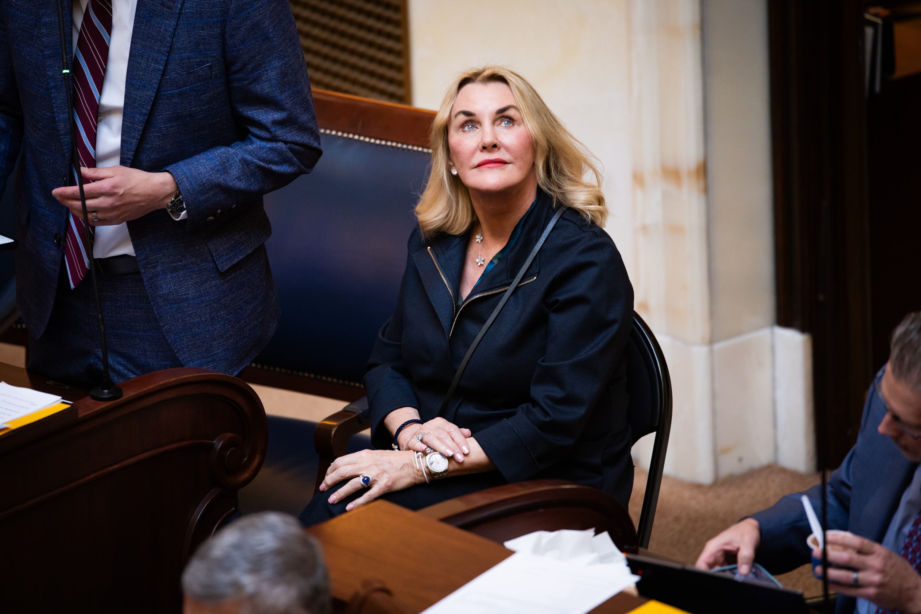 Patti Wheeler, from Florida, whose son died from a kratom overdose, center, sits with Sen. Mike McKell, R-Spanish Fork, left, on the Senate floor at the Capitol in Salt Lake City on Thursday.