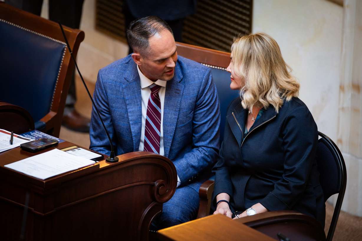 Patti Wheeler, from Florida, whose son died from a kratom overdose, right, sits with Sen. Mike McKell, R-Spanish Fork, left, on the Senate floor at the Capitol in Salt Lake City on Thursday.