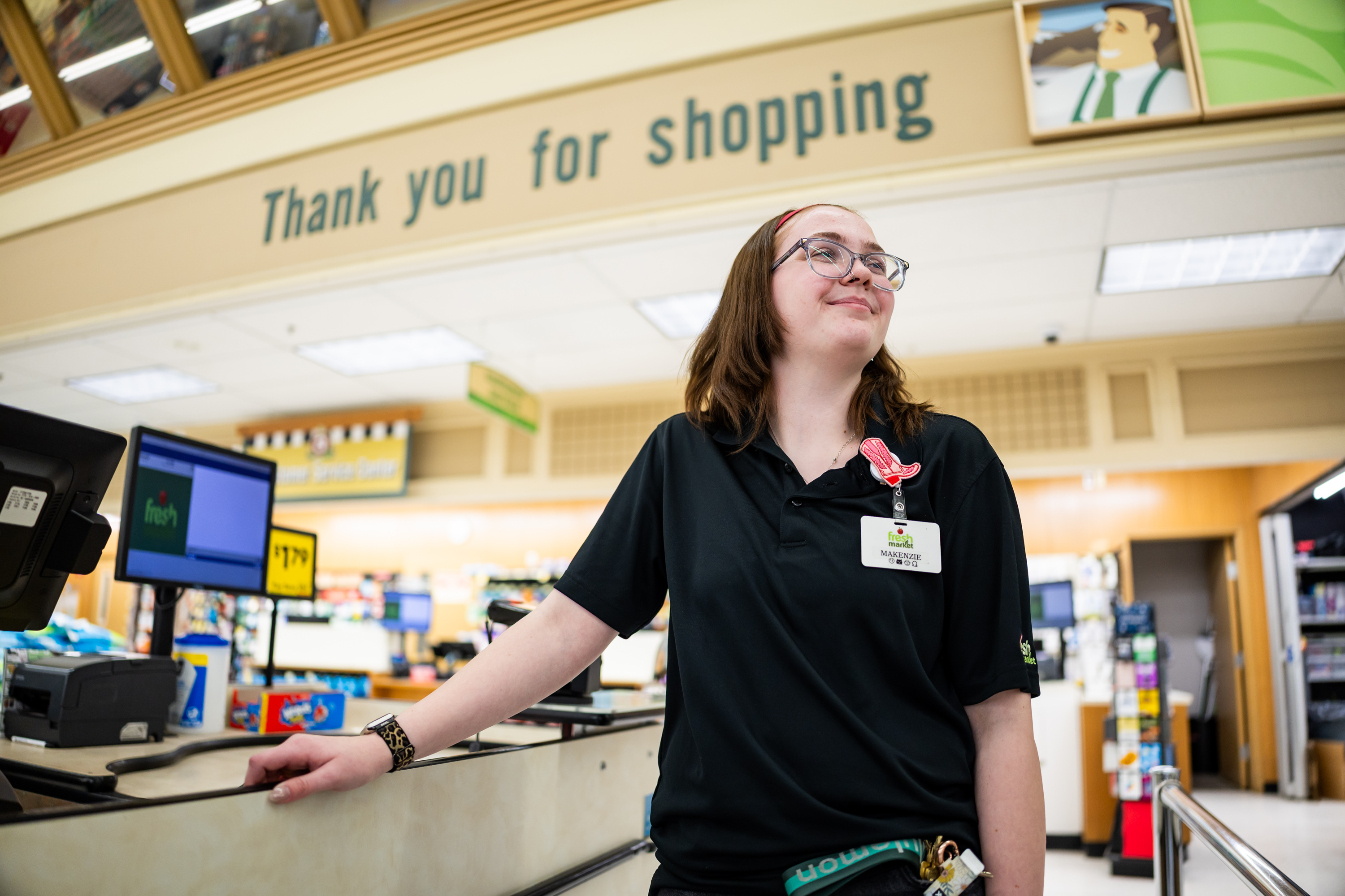 MaKenzie Wood, who earned a second-place finish at the National Grocers Association’s Best Bagger Competition, poses at Fresh Market in Layton on Friday.