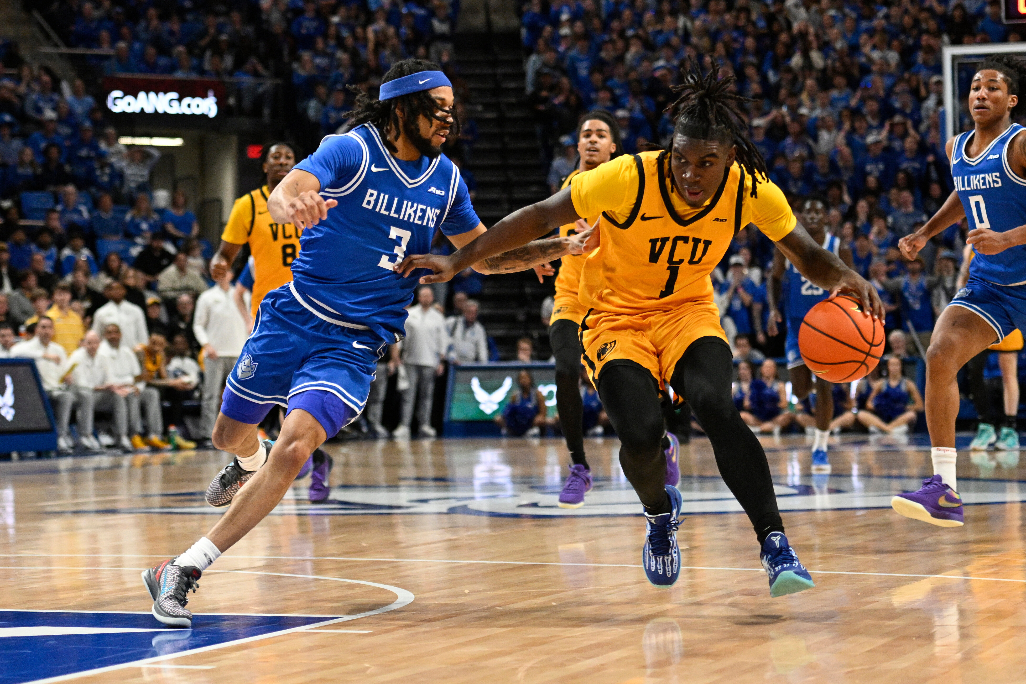 Saint Louis' Trey Green (3) defends against Virginia Commonwealth's Nyk Lewis (1) during the first half of an NCAA college basketball game, Friday, Feb. 20, 2026, in St. Louis.