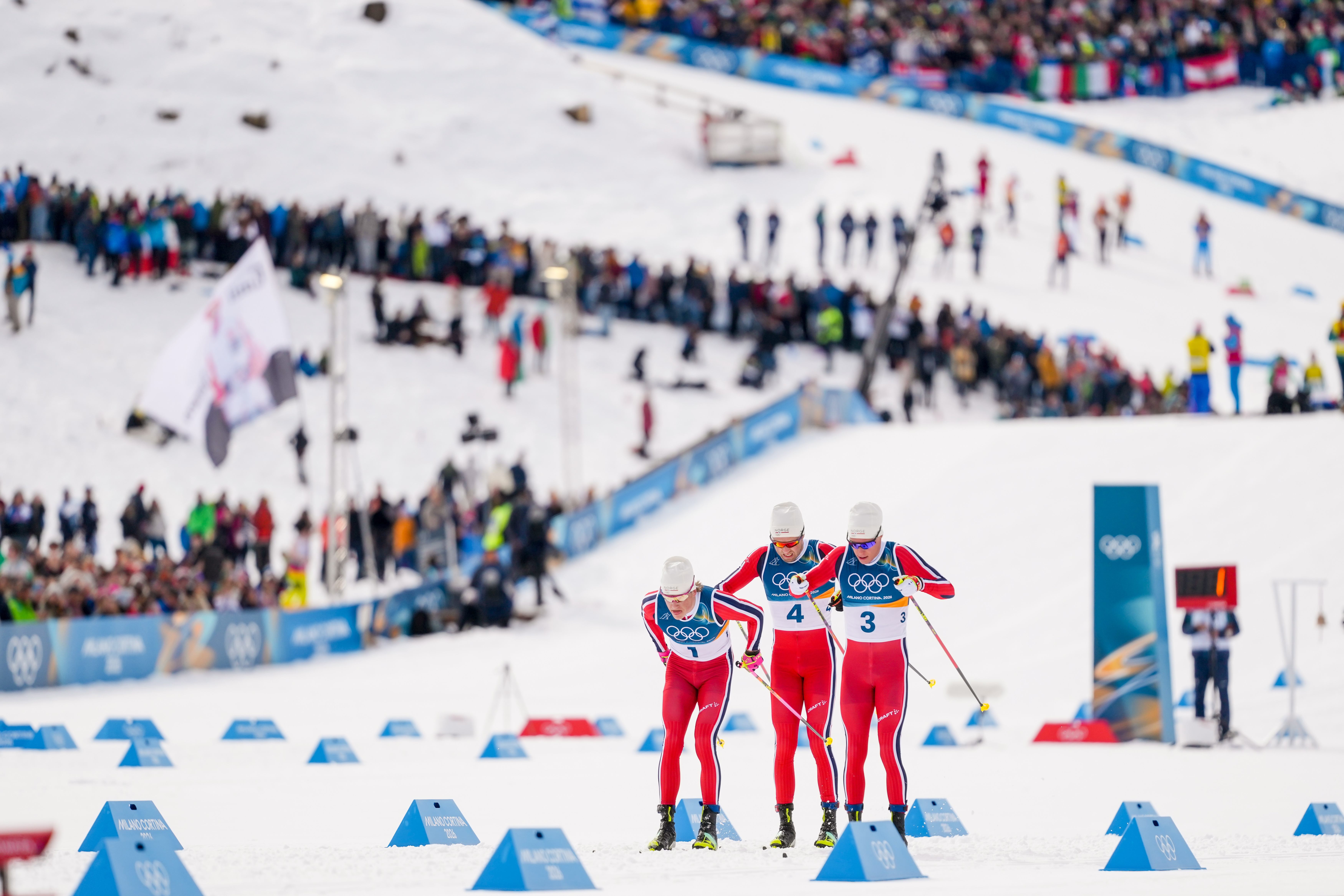 Johannes Hoesflot Klaebo, from left, Emil Iversen and Martin Loewstroem Nyenget, all three of Norway, compete in the cross country skiing men's 50km mass start Classic at the 2026 Winter Olympics, in Tesero, Italy, Saturday, Feb. 21, 2026. 