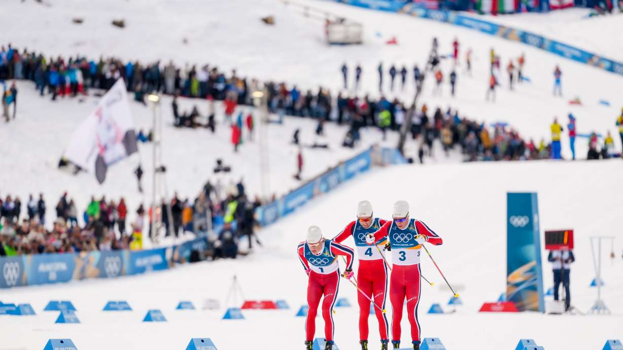 Johannes Hoesflot Klaebo, from left, Emil Iversen and Martin Loewstroem Nyenget, all three of Norway, compete in the cross country skiing men's 50km mass start Classic at the 2026 Winter Olympics, in Tesero, Italy, Saturday, Feb. 21, 2026.