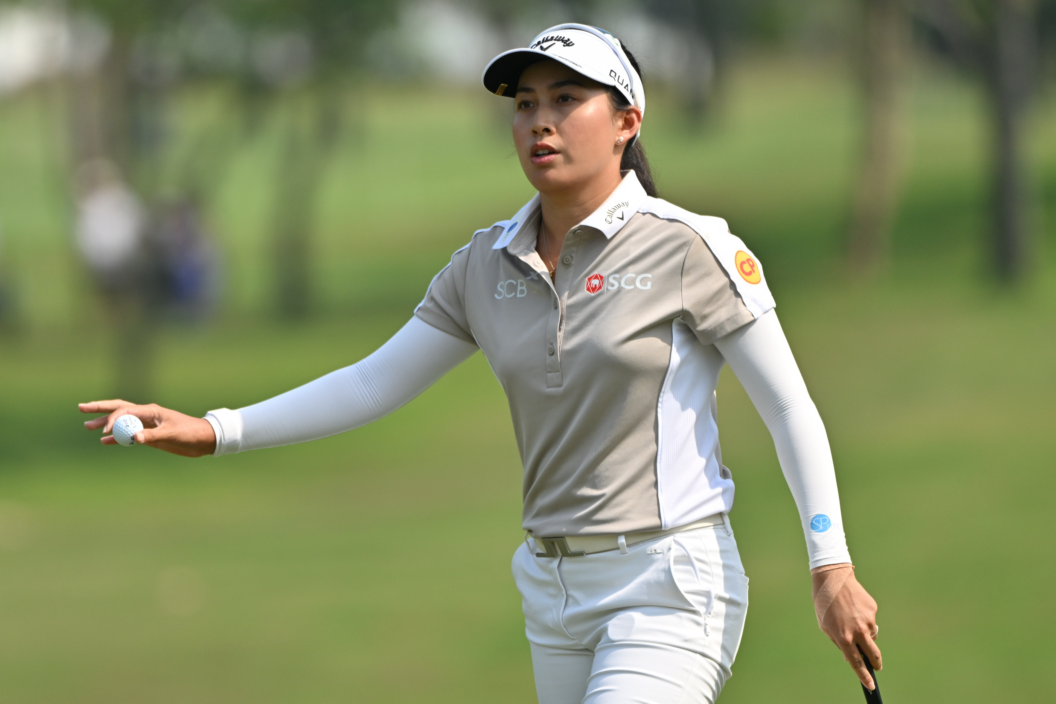 Jeeno Thitikul of Thailand reacts after putting on the first hole during the first round of the LPGA Honda Thailand golf tournament in Pattaya, Thailand, Thursday, Feb. 19, 2026.