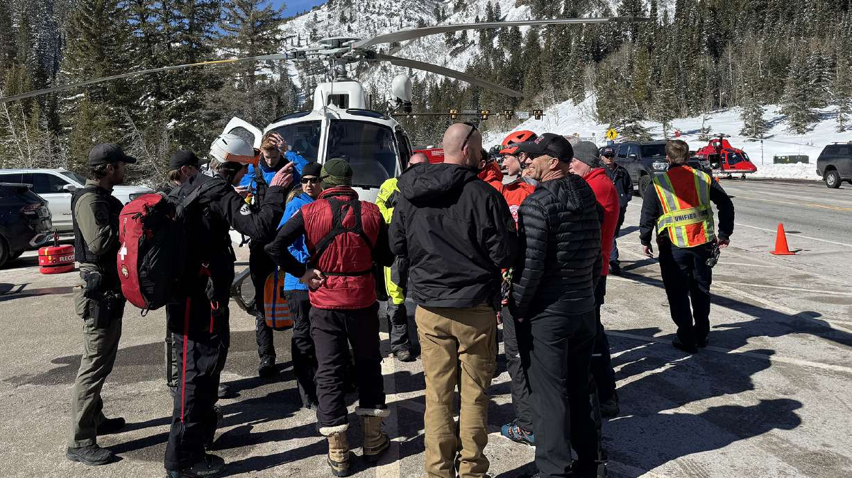 Rescue crews evacuate two people who got caught in an avalanche in Big Cottonwood Canyon on Saturday.