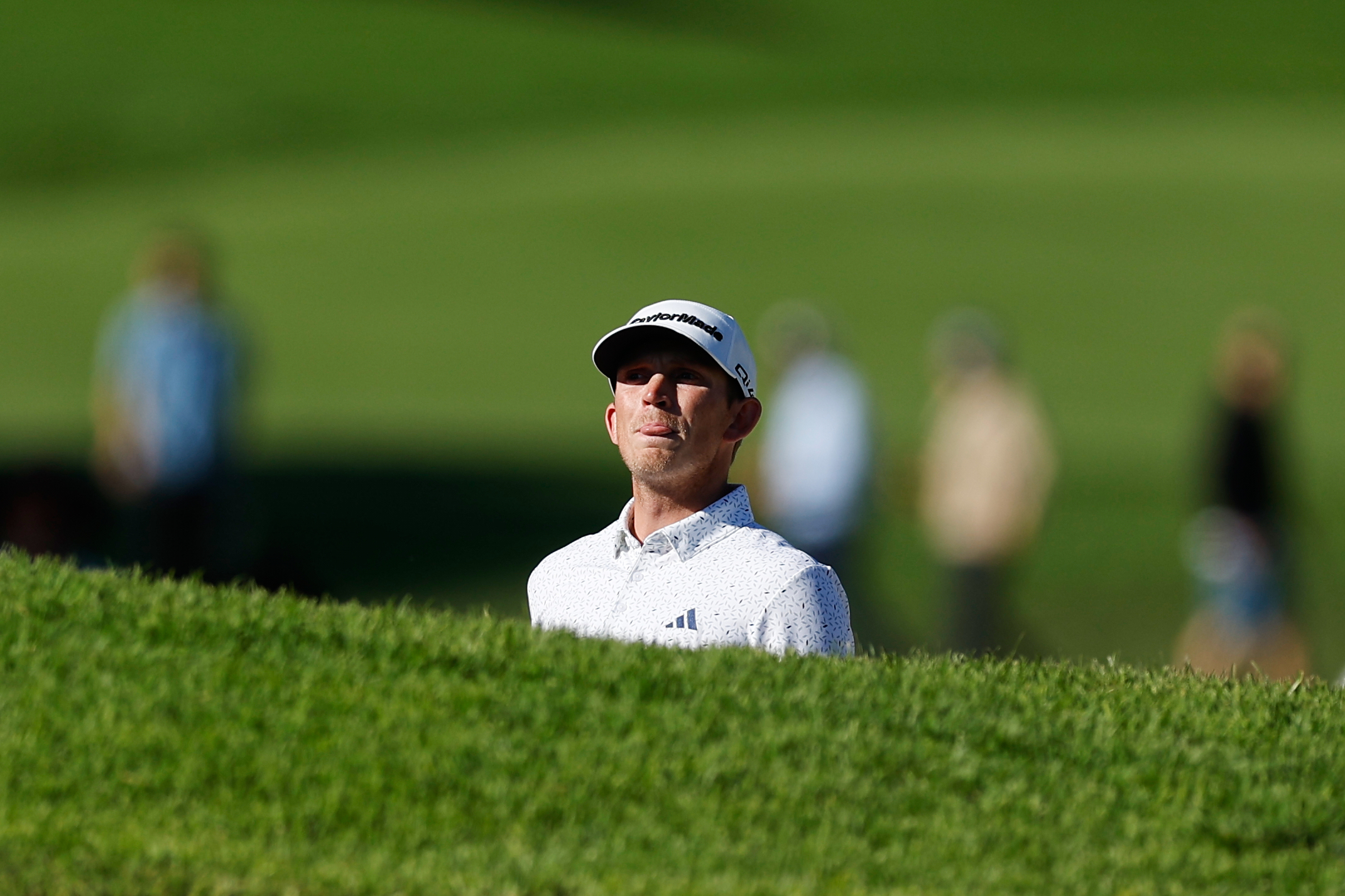 Jacob Bridgeman prepares to hit from a bunker on the 14th hole during the third round of the Genesis Invitational golf tournament at Riviera Country Club, Saturday, Feb. 21, 2026, in the Pacific Palisades area of Los Angeles. 
