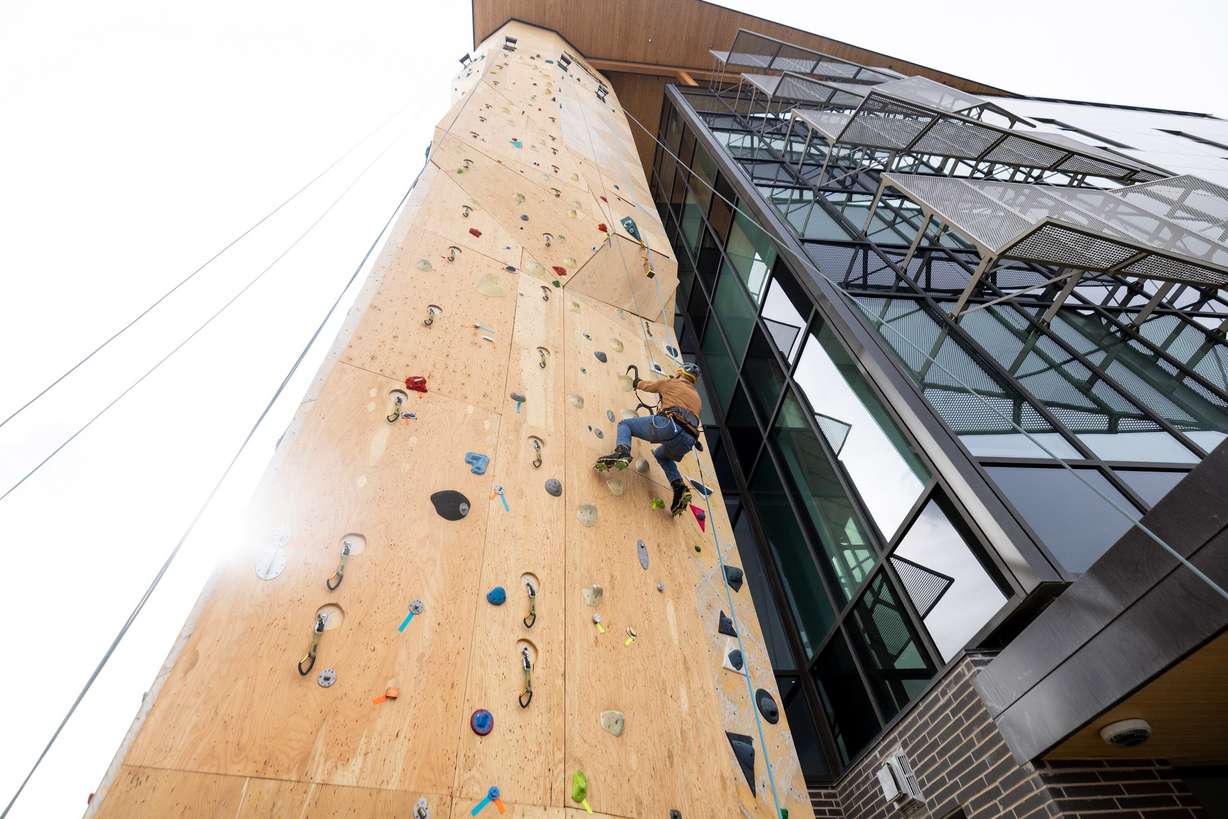 Frank Zabka climbs the dry tooling wall at the Millcreek Common in Millcreek on Feb. 16.