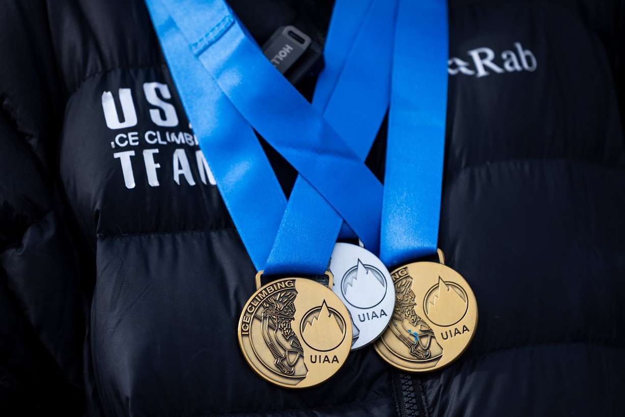 Conner Bailey displays his UIAA Ice Climbing medals during an outdoor dry tooling clinic hosted by The Scratch Pad at the Millcreek Common in Millcreek on Feb. 16.