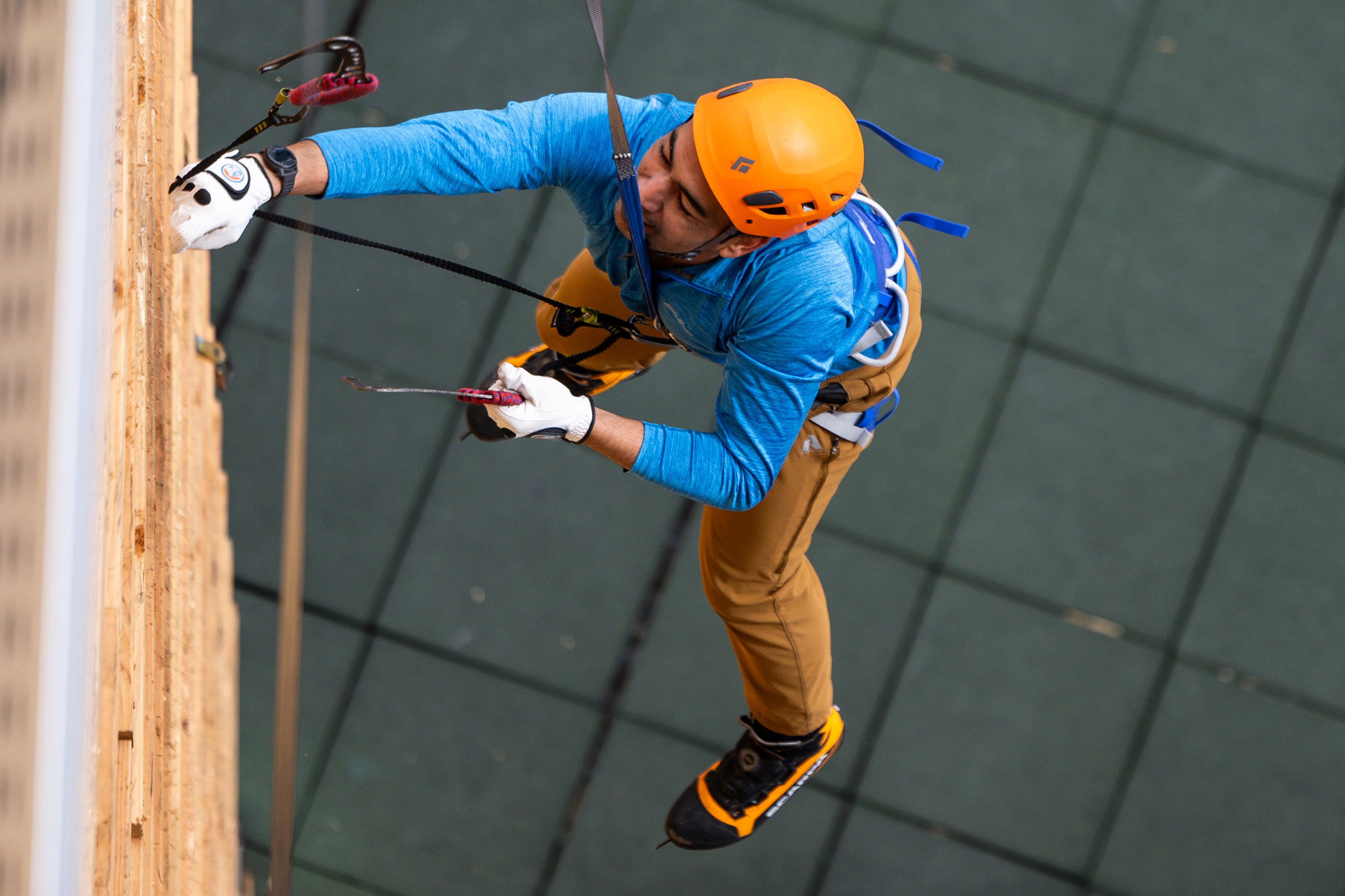 A climber falls while attempting the speed wall at the Millcreek Common in Millcreek on Feb. 16.