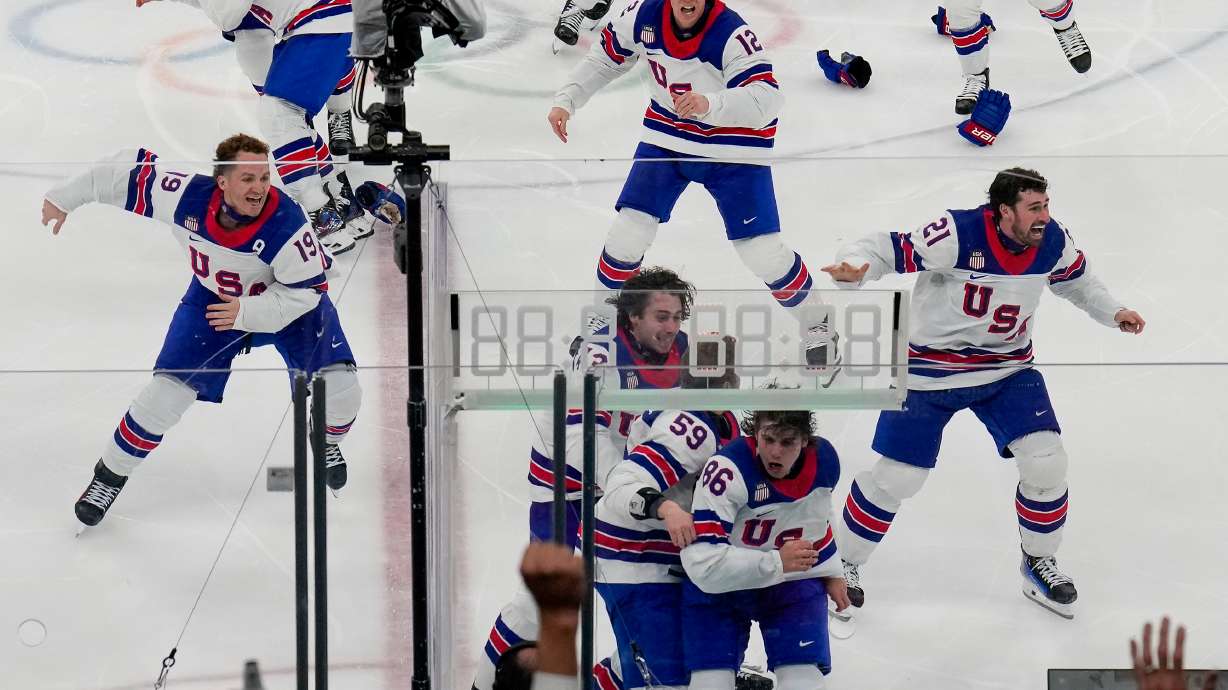 The United States celebrates after a sudden-death overtime goal by United States' Jack Hughes (86) against Canada during the men's ice hockey gold medal game at the 2026 Winter Olympics, in Milan, Italy, Sunday, Feb. 22, 2026.