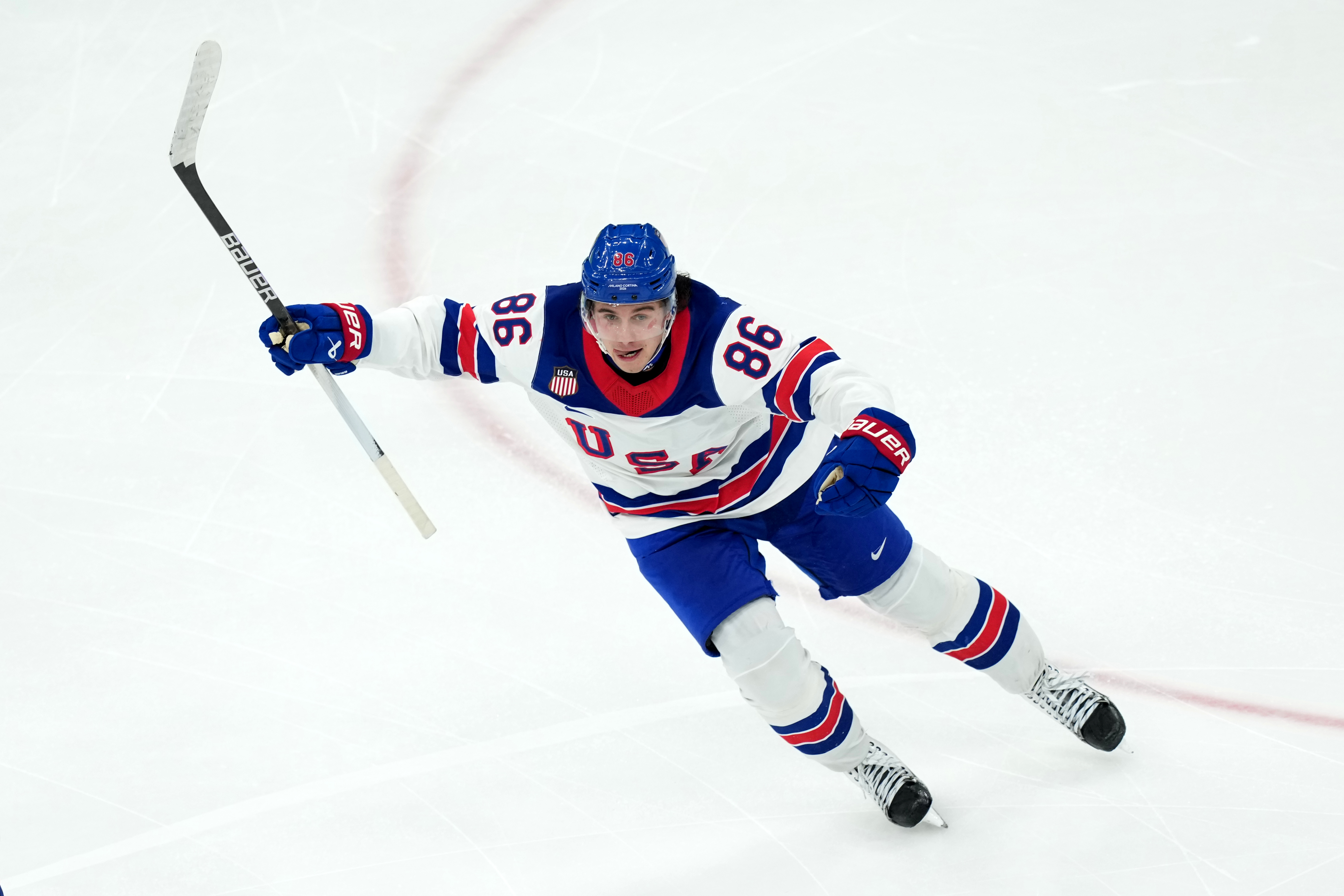 United States' Jack Hughes celebrates after scoring the winning goal against Canada during the overtime period of the men's ice hockey gold medal game at the 2026 Winter Olympics in Milan, Italy, Sunday.