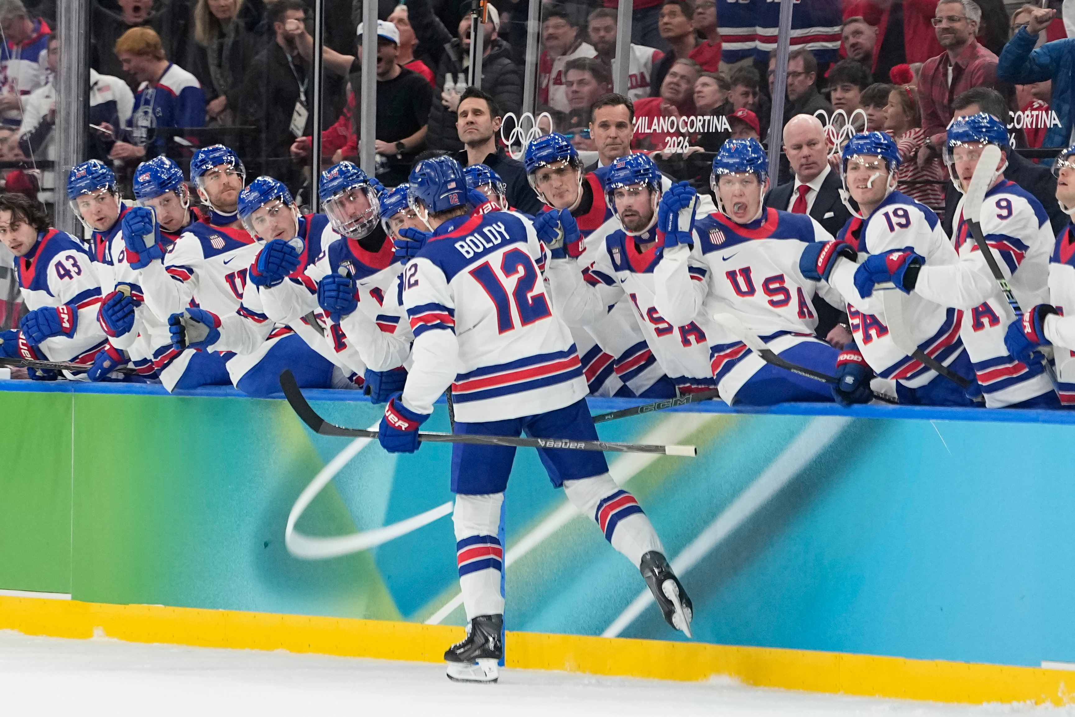 United States' Matt Boldy celebrates with teammates after scoring the opening goal during a men's ice hockey gold medal game between Canada and the United States at the 2026 Winter Olympics, in Milan, Italy, Sunday.