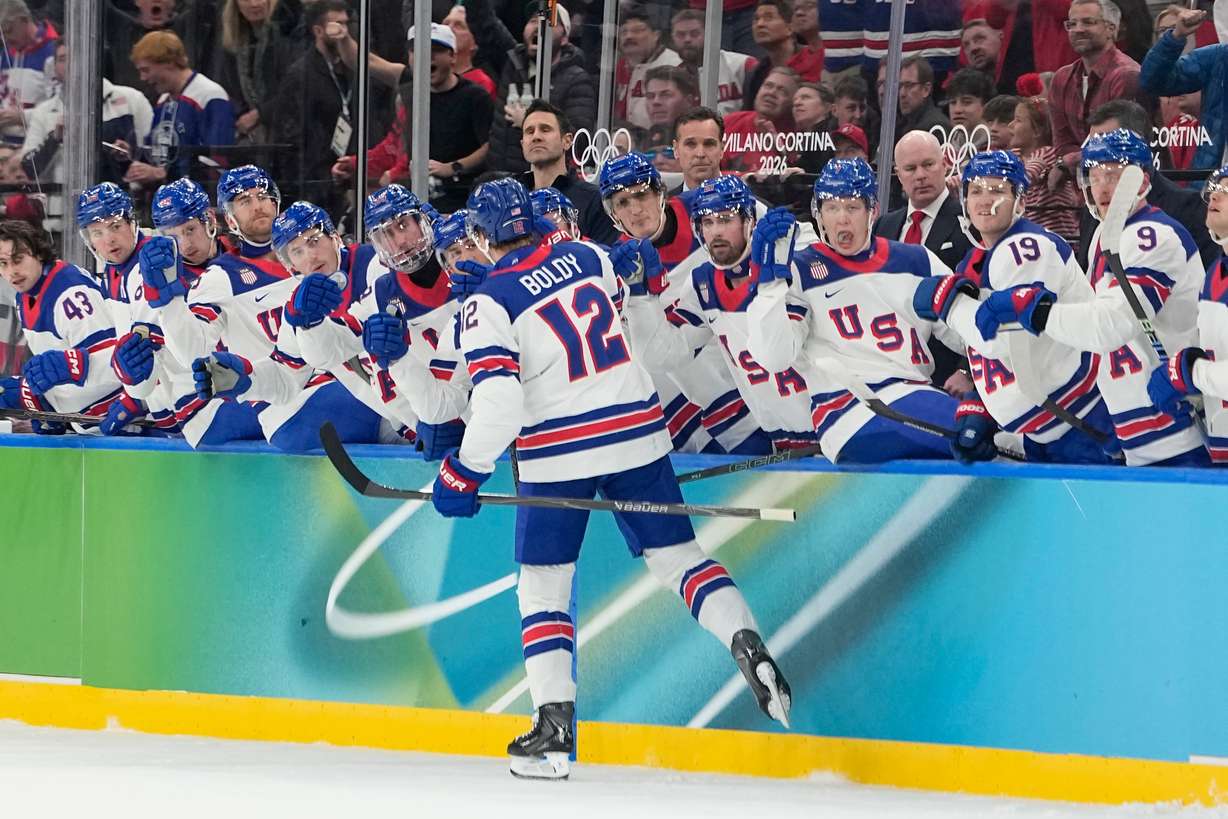 United States' Matt Boldy celebrates with teammates after scoring the opening goal during a men's ice hockey gold medal game between Canada and the United States at the 2026 Winter Olympics, in Milan, Italy, Sunday.