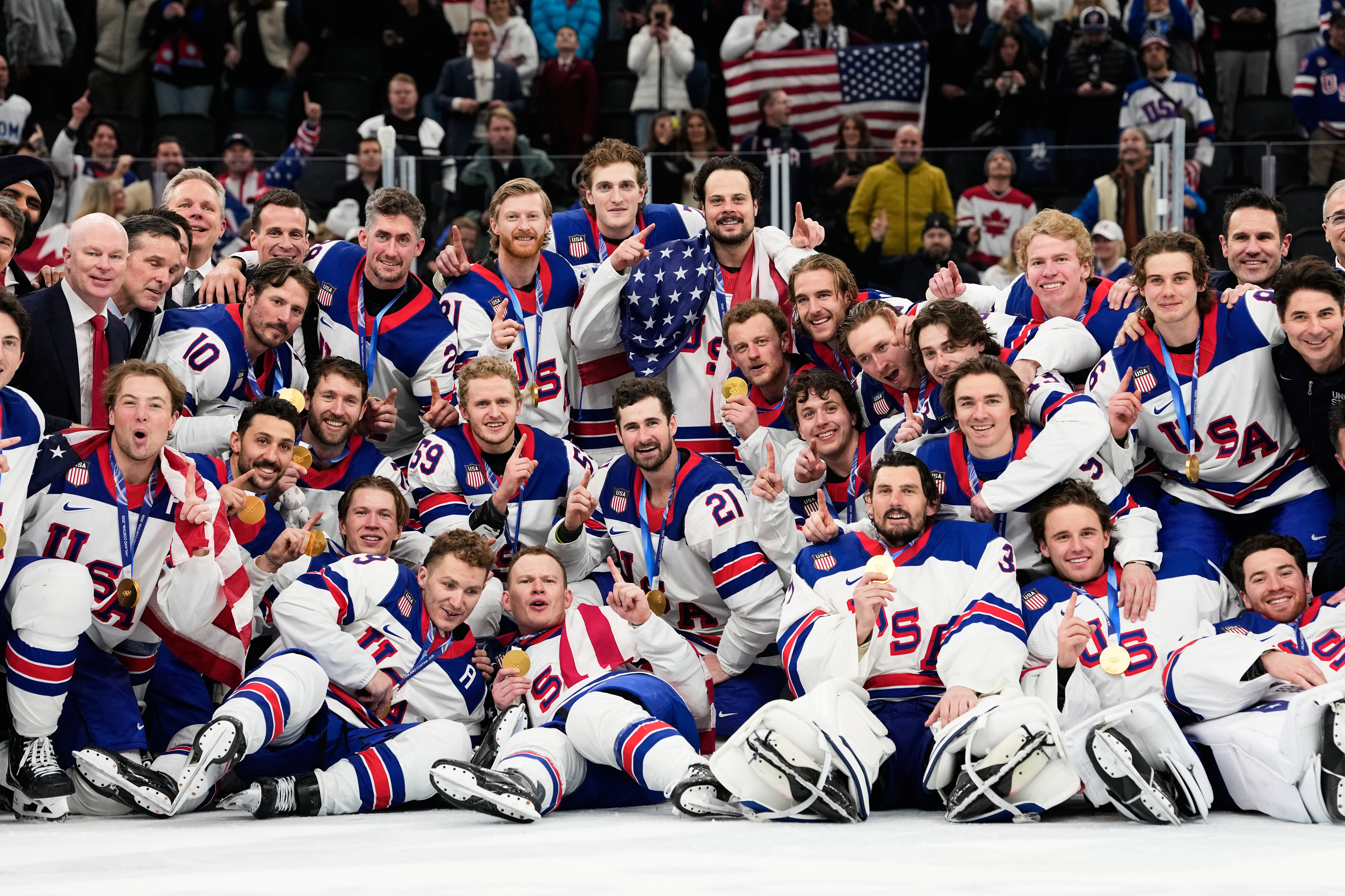 Gold medalists of the United States pose after the men's ice hockey gold medal game between Canada and the United States at the 2026 Winter Olympics, in Milan, Italy, Sunday.
