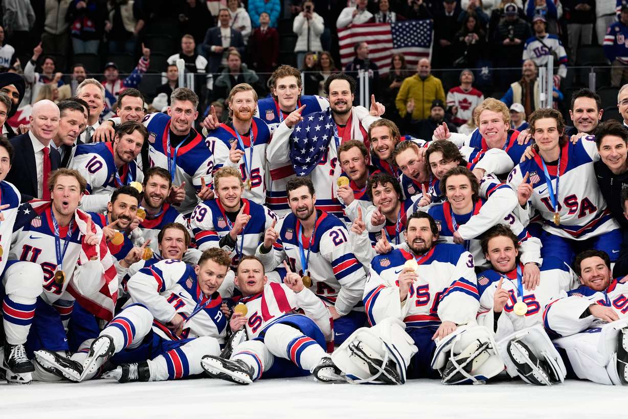Gold medalists of the United States pose after the men's ice hockey gold medal game between Canada and the United States at the 2026 Winter Olympics, in Milan, Italy, Sunday.