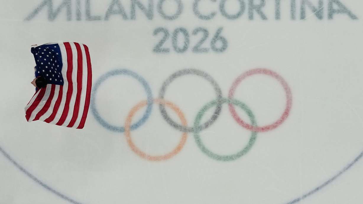 United States' goalie Connor Hellebuyck celebrates after the United States beat Canada in overtime in the men's gold medal hockey game at the 2026 Winter Olympics, in Milan, Italy, Sunday, Feb. 22, 2026.