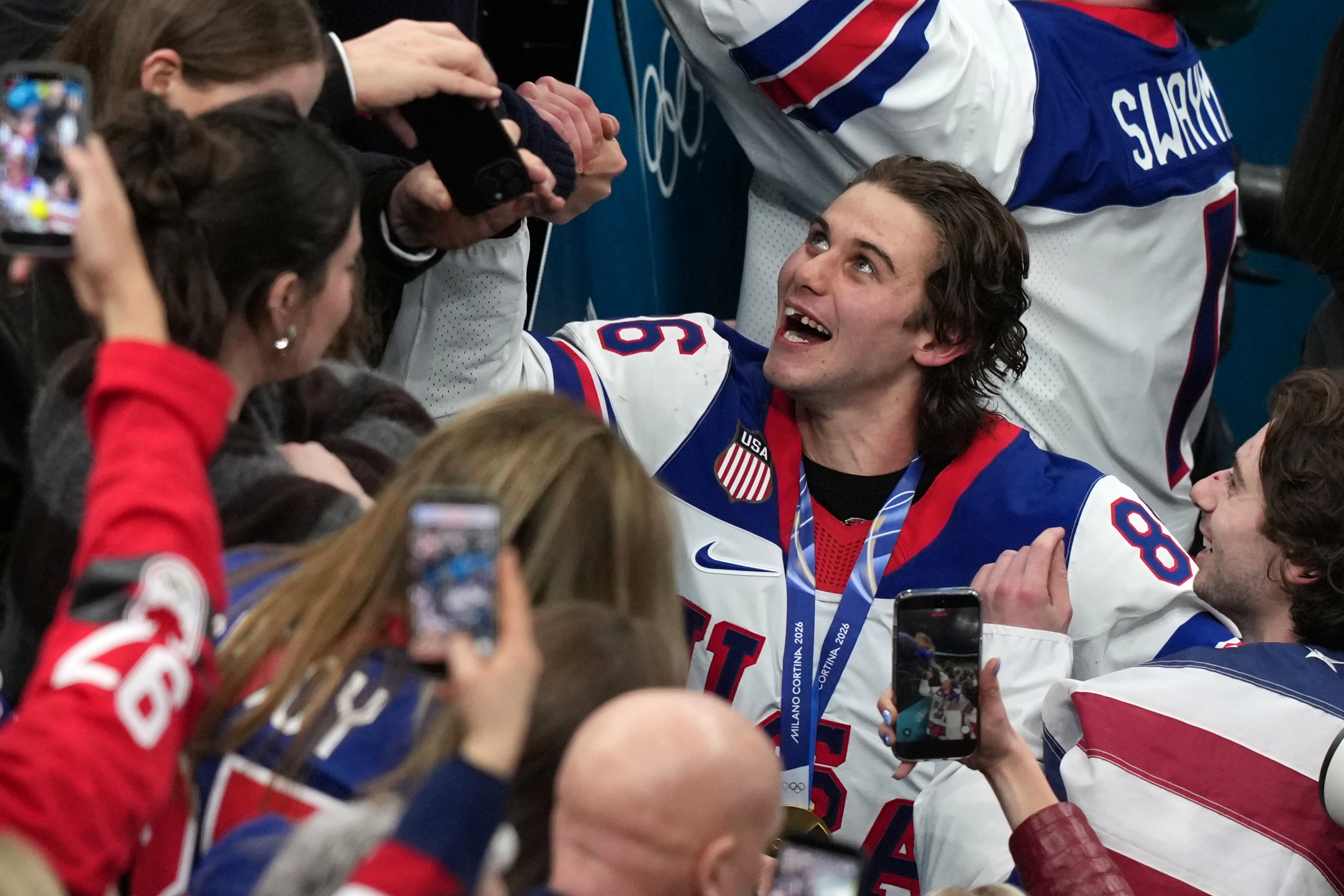 United States' Jack Hughes (86), who scored the winning overtime goal, celebrates after defeating Canada in the men's ice hockey gold medal game at the 2026 Winter Olympics in Milan, Italy, Sunday, Feb. 22, 2026. 