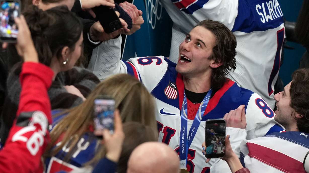 United States' Jack Hughes (86), who scored the winning overtime goal, celebrates after defeating Canada in the men's ice hockey gold medal game at the 2026 Winter Olympics in Milan, Italy, Sunday, Feb. 22, 2026.