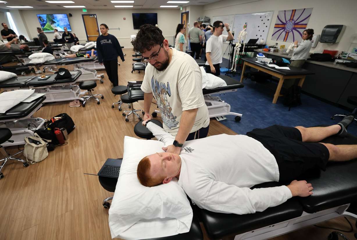 Second-year doctor of physical therapy student Kaden Kennard does upper limb nerve testing on fellow second-year student Kyle Watkins at Rocky Mountain University in Provo on Jan. 14.
