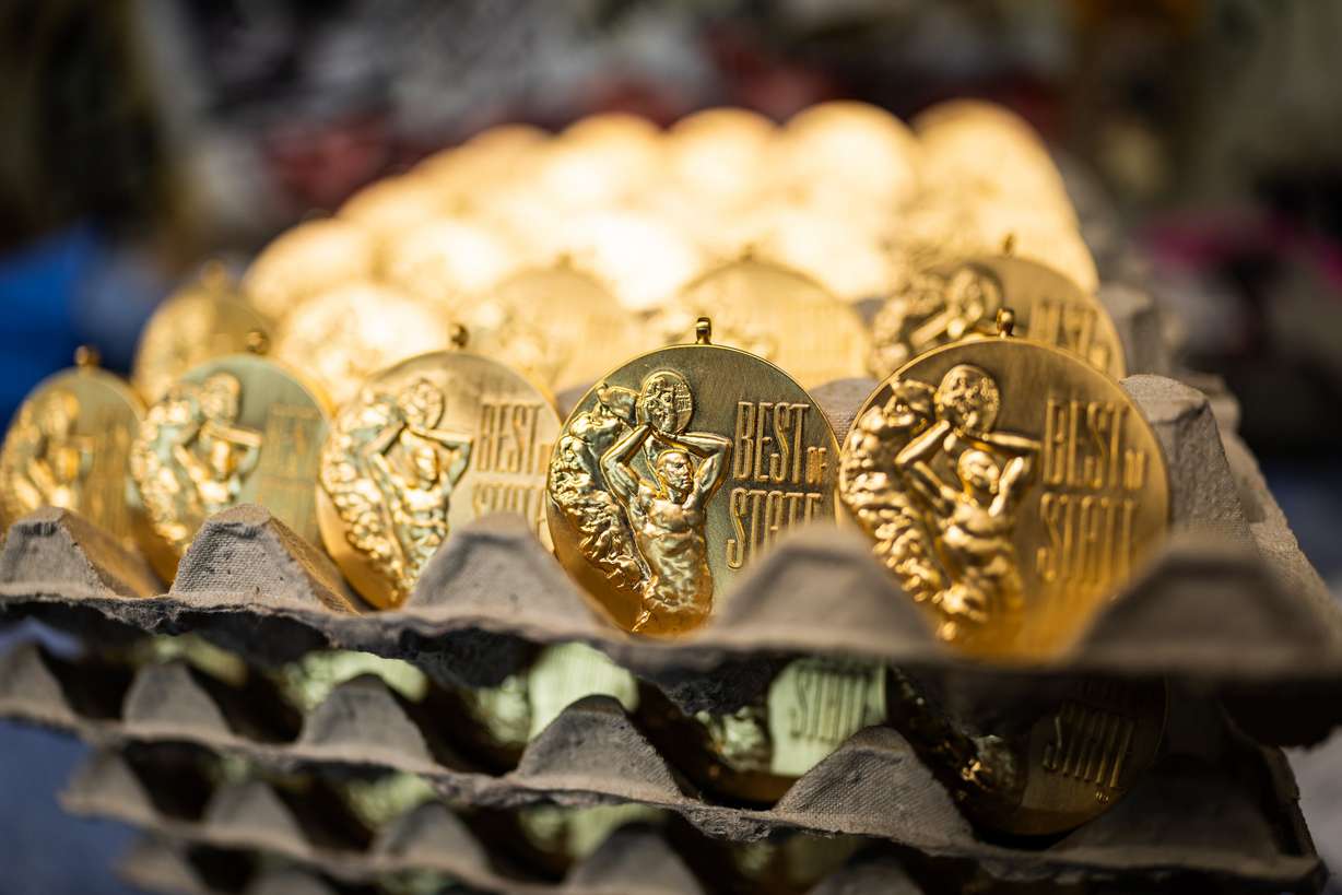 Best of State medals are shown at a workstation at Quality Plating Co. Inc.'s main plant in Salt Lake City on Feb. 4. The business has roots in Germany from owner Glenn Fassmann's grandfather, Walther Fassmann, after Walther returned from service in World War I, who then brought the business to Salt Lake City.