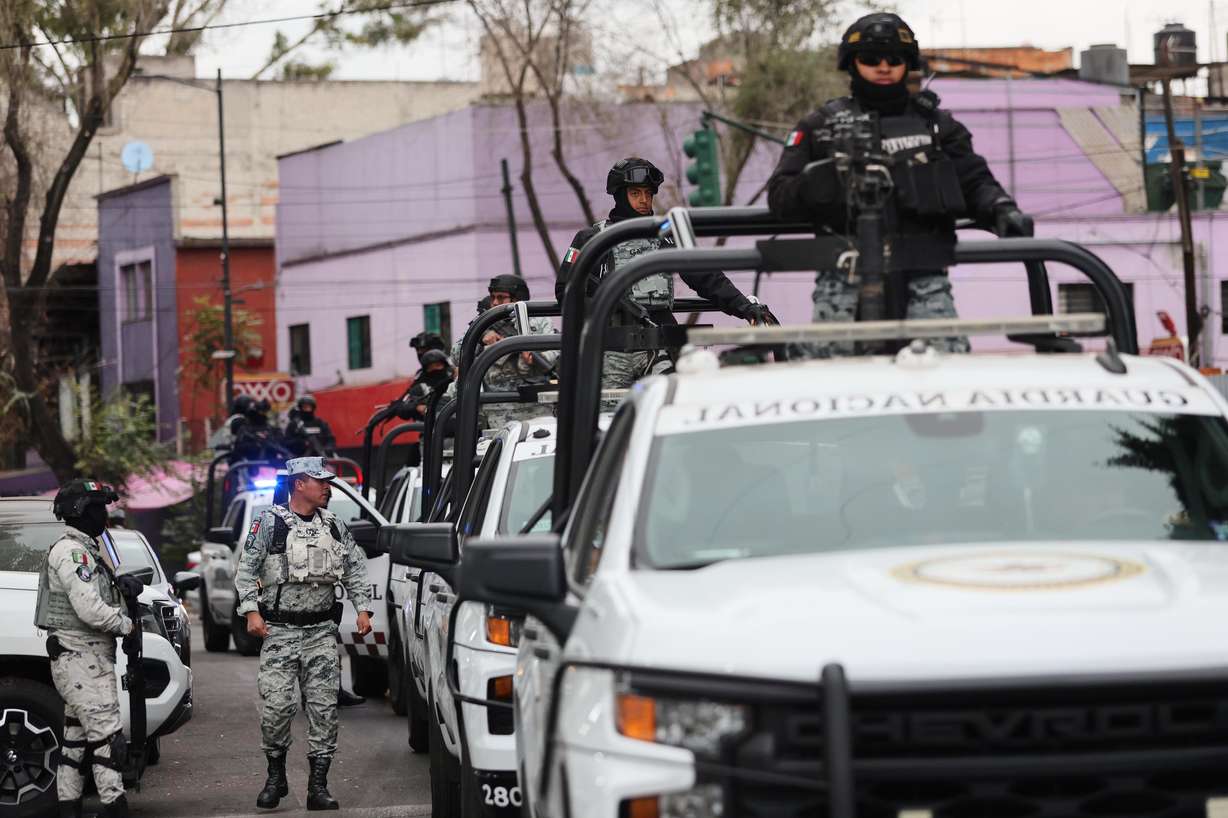 National Guards patrol the area outside of the General Prosecutor's headquarters in Mexico City, Sunday, after authorities reported that the Mexican Army killed Jalisco New Generation Cartel leader Nemesio Oseguera, known as "El Mencho."