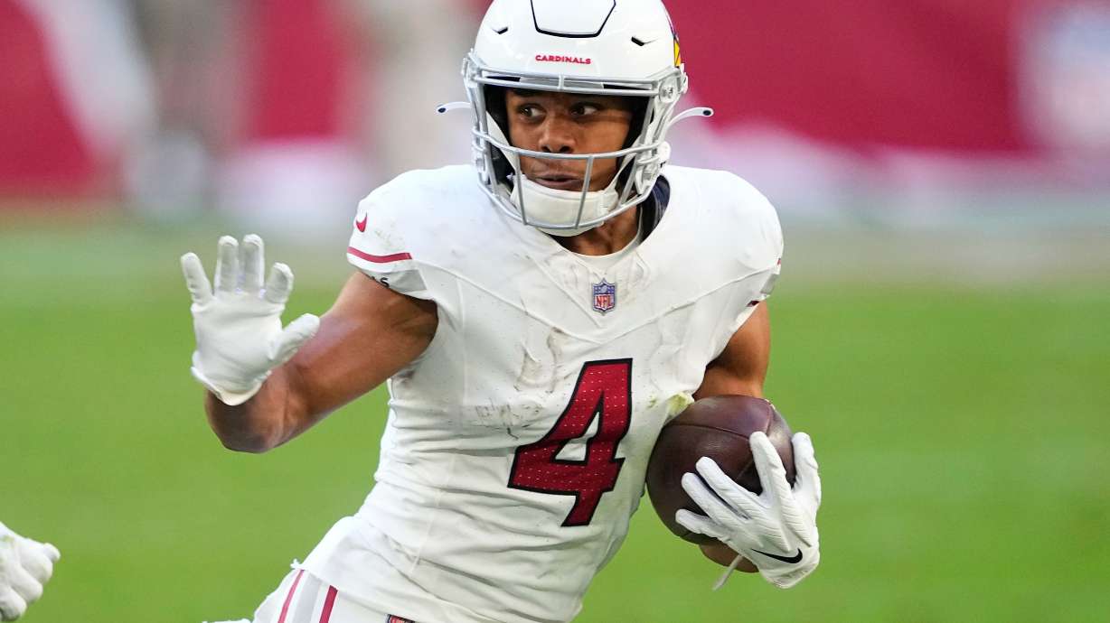 FILE - Arizona Cardinals wide receiver Rondale Moore (4) runs against the San Francisco 49ers during the first half of an NFL football game, Dec. 17, 2023, in Glendale, Ariz.