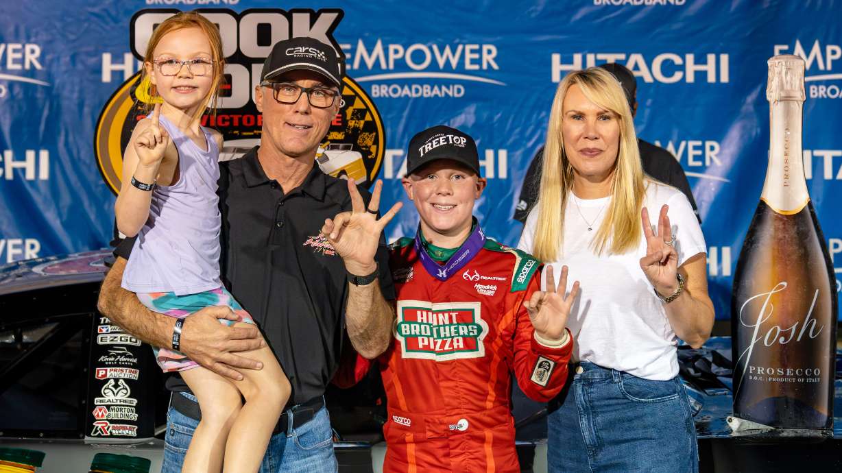 In this undated image provided by Kevin Harvick, Inc., Keelan Harvick, center, poses with his family, from left, sister Piper, father retired NASCAR driver Kevin Harvick and mother DeLana Harvick following a victory.