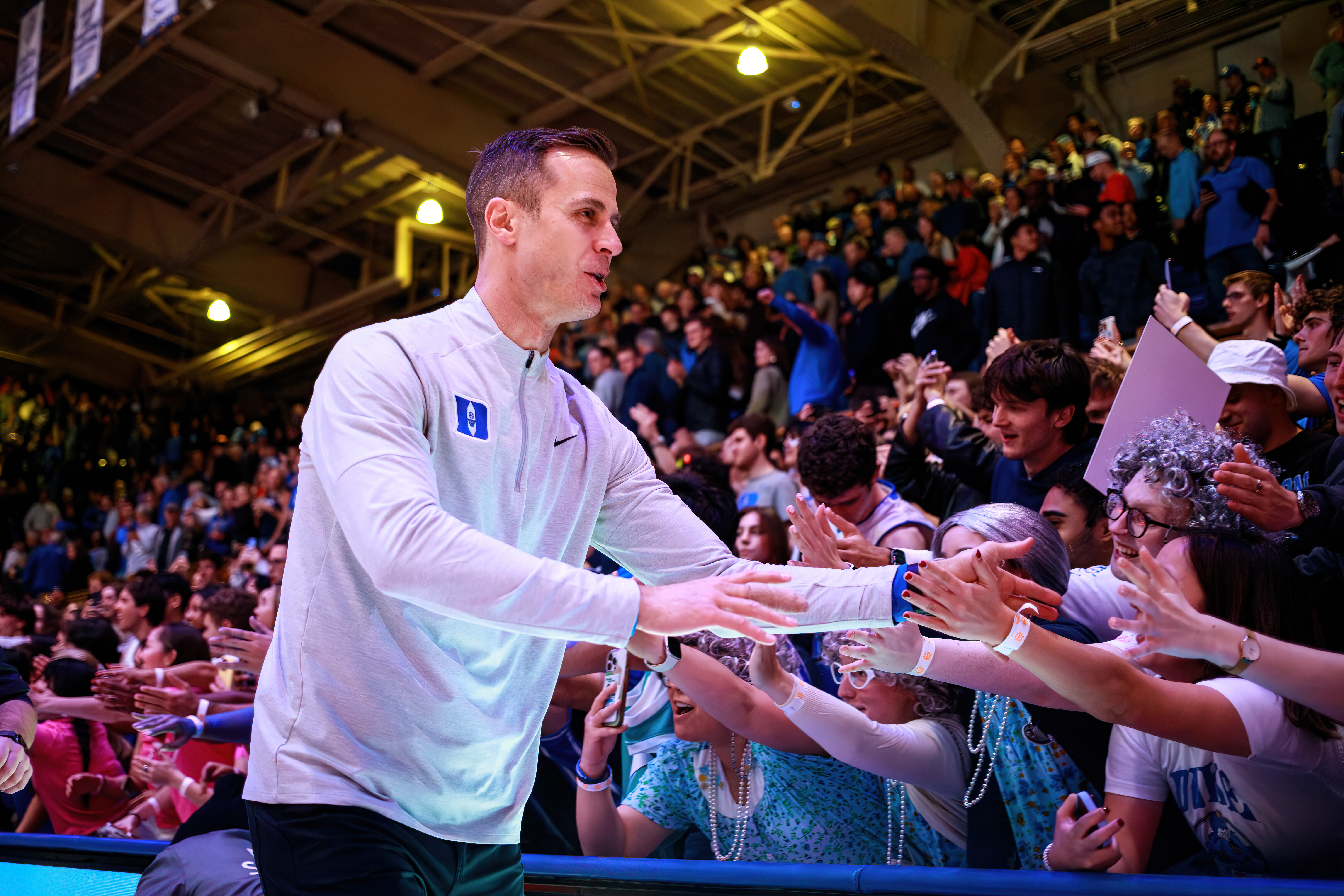 Duke head coach Jon Scheyer greets fans after his team defeated Syracuse in an NCAA college basketball game in Durham, N.C., Monday, Feb. 16, 2026. 