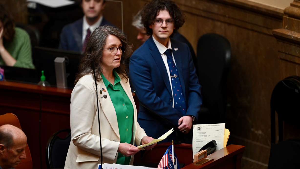 Rep Nicholeen P. Peck, R-Tooele, presents Utah Valley University Turning Point USA Chapter President Caleb Chilcutt legislative citations honoring the life and service of Charlie Kirk at the Capitol in Salt Lake City on Monday.