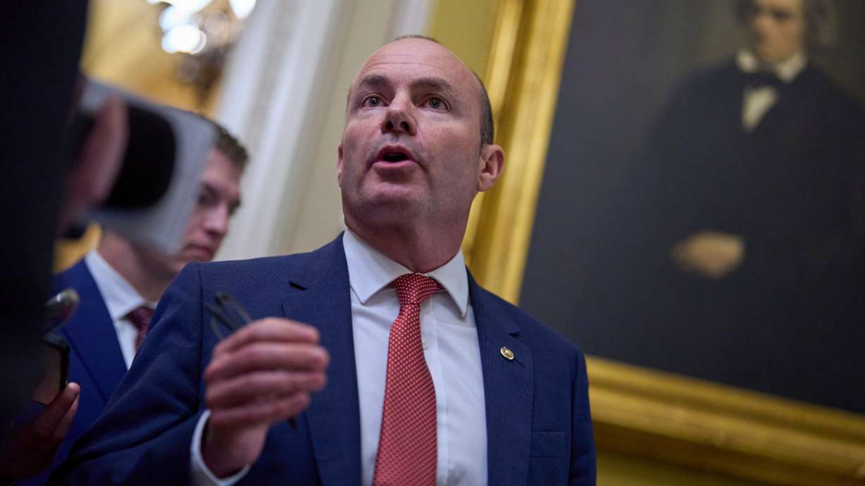 Sen. Mike Lee, R-Utah, speaks to a reporter as senators arrive for votes and policy meetings, at the Capitol in Washington, June 17, 2025.