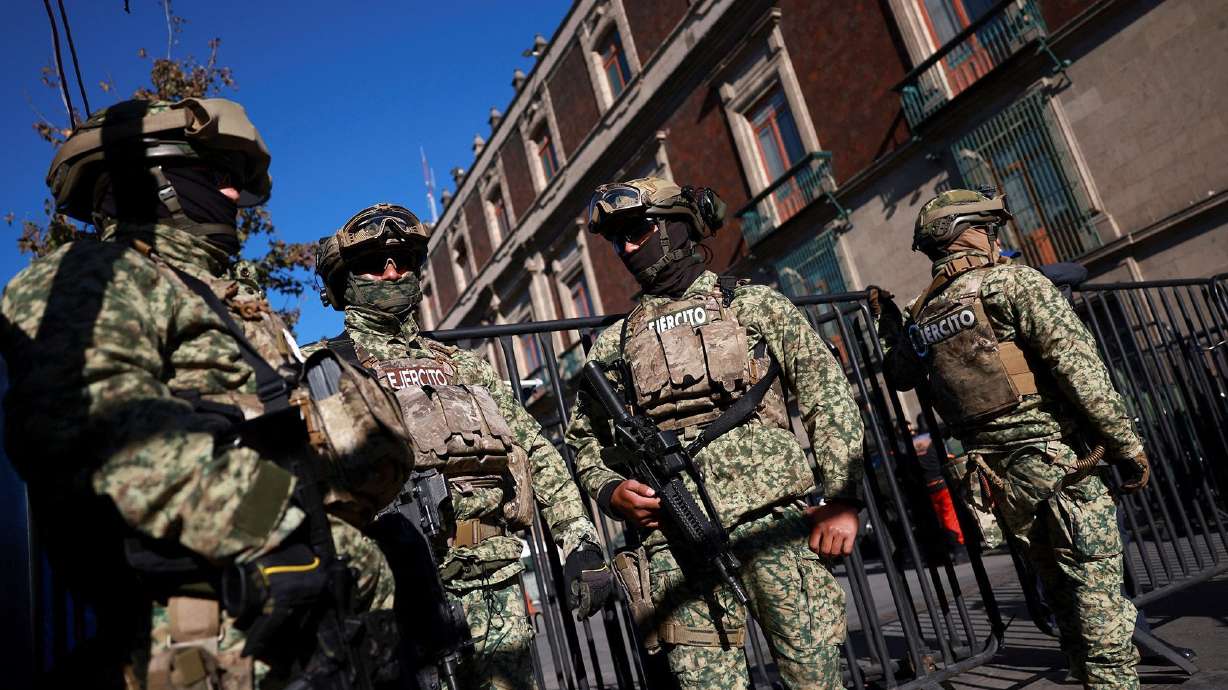 Military personnel patrol the Palacio Nacional in Mexico City following the killing of drug lord "El Mencho" in a military operation on Sunday.