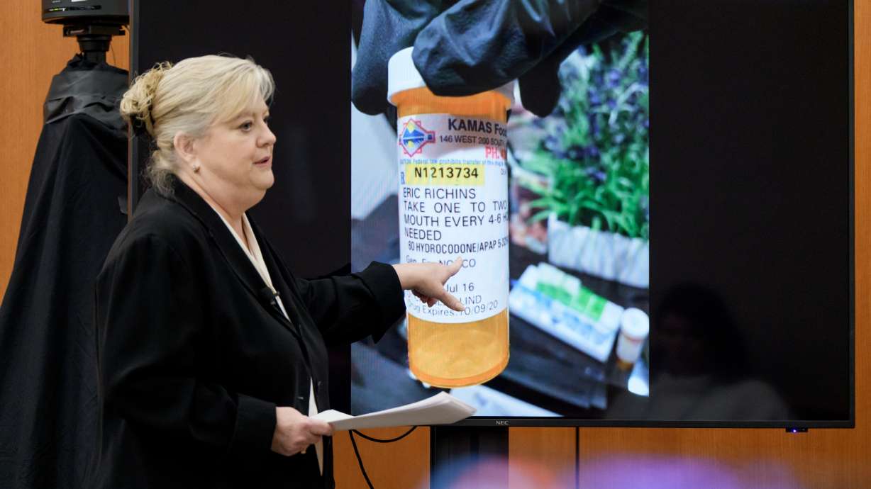 Kathy Nester, defense attorney for Kouri Richins, a Utah mother accused of fatally poisoning her husband, shows the jury an image of a pill bottle while delivering her opening statement in Richins' murder trial at the Summit County Courthouse Monday.