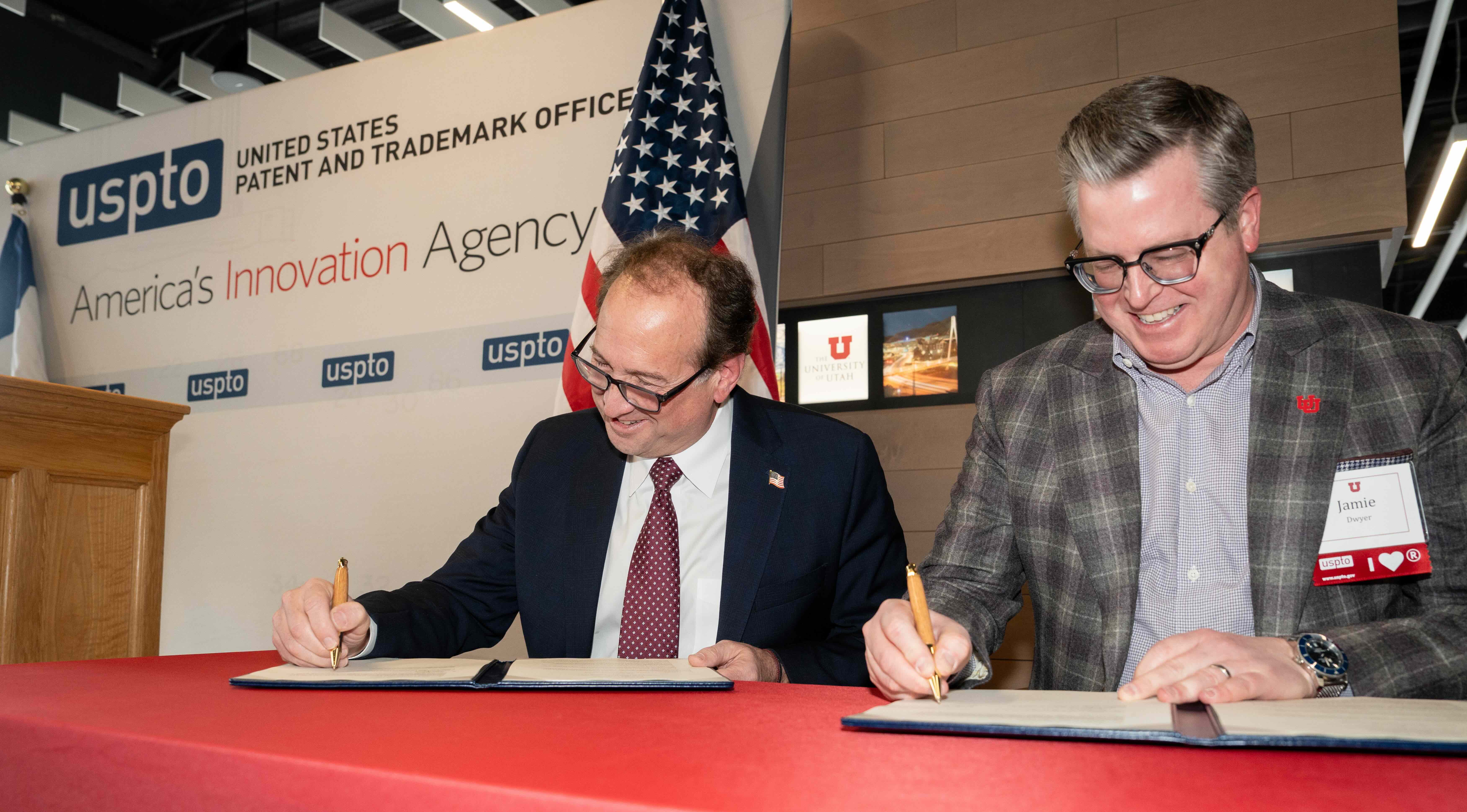 U.S. Patent and Trademark Office Director John Squires and Jamie Dwyer, a vice president at the University of Utah, sign an agreement last week to open a U.S. Patent and Trademark Office at the U.