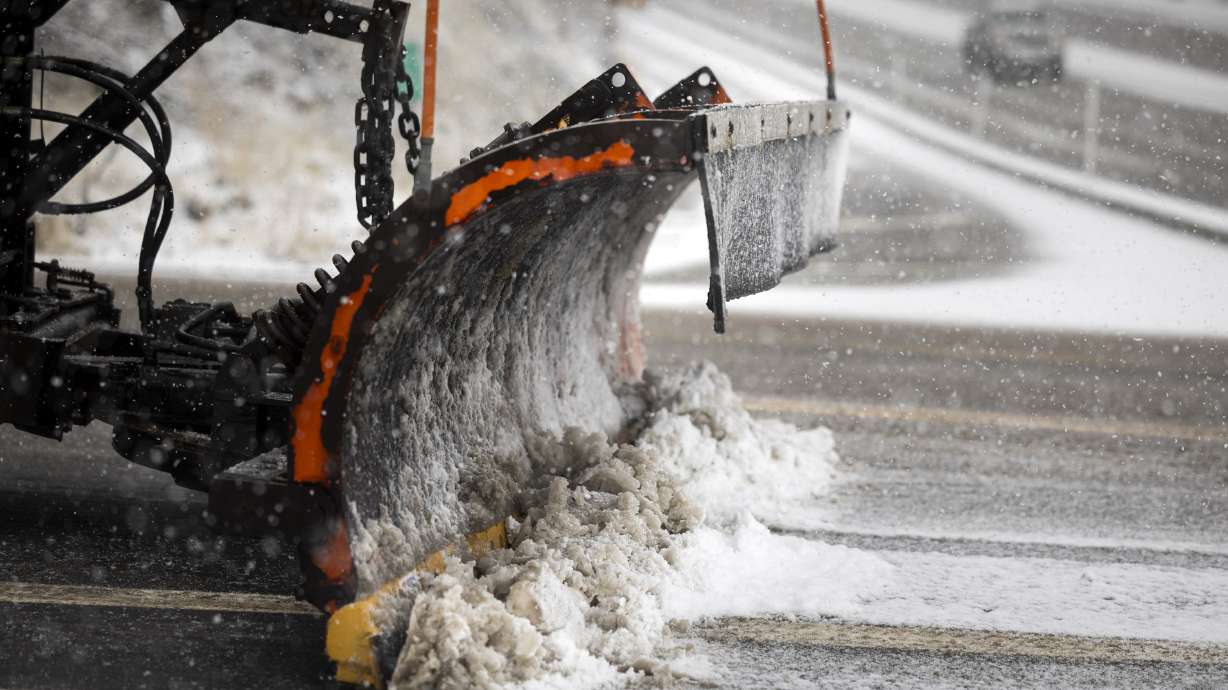 A snowplow leaves Big Cottonwood Canyon as snow falls along state Route 190 in Cottonwood Heights on Feb. 18. More rain and snow have impacted Utah this week, as Utah's snowpack remains well below normal statewide.